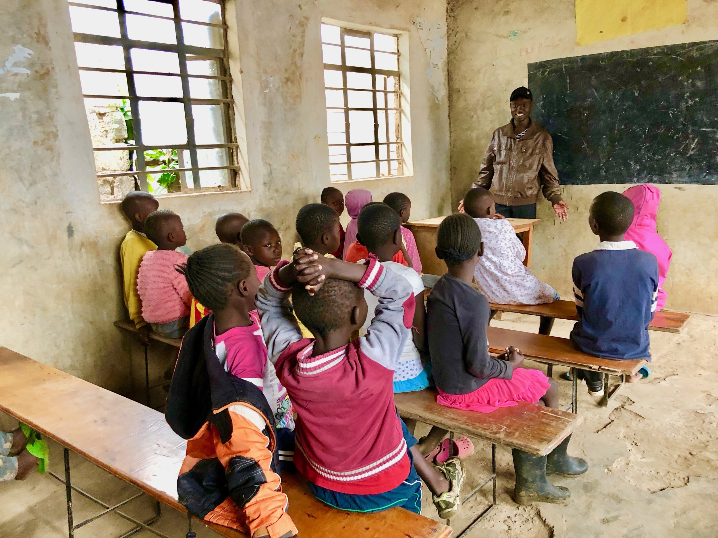 Vincent teaching the kids in the middle class