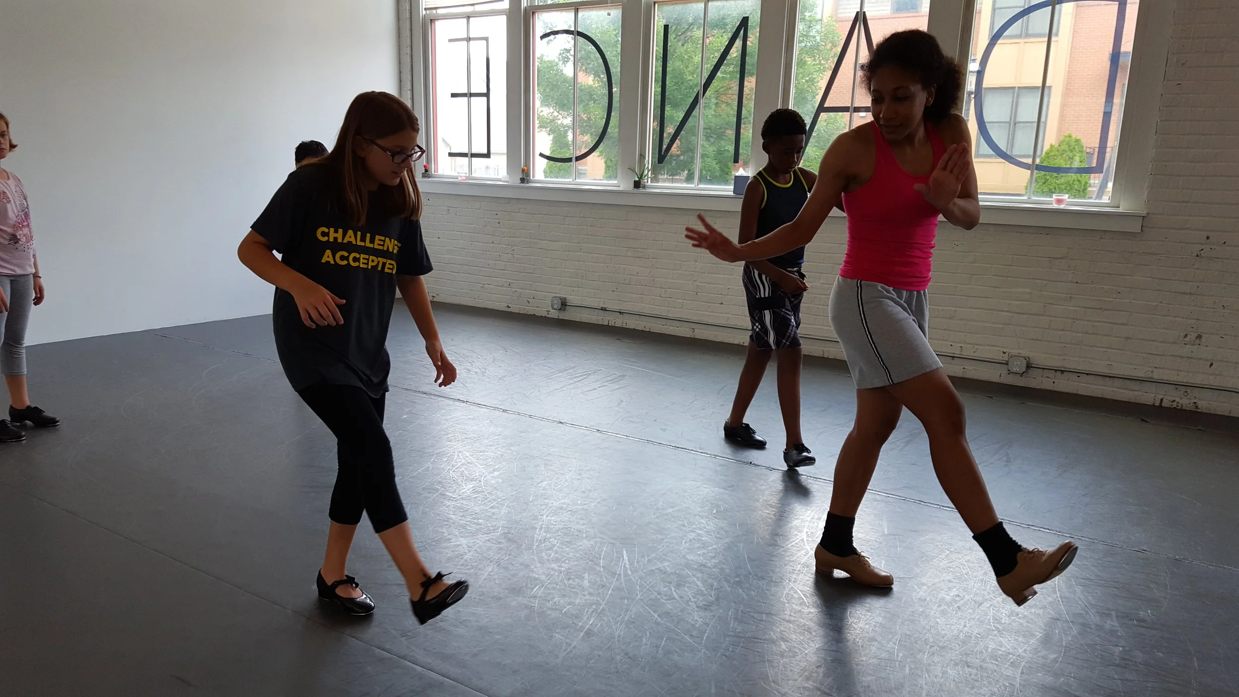 Students learn tap from Educator Olivia Perez