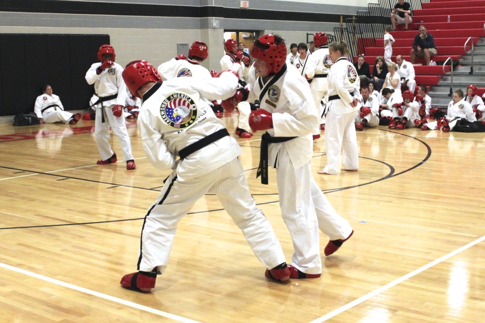 Martial arts students developing self-defense skills through sparring.
