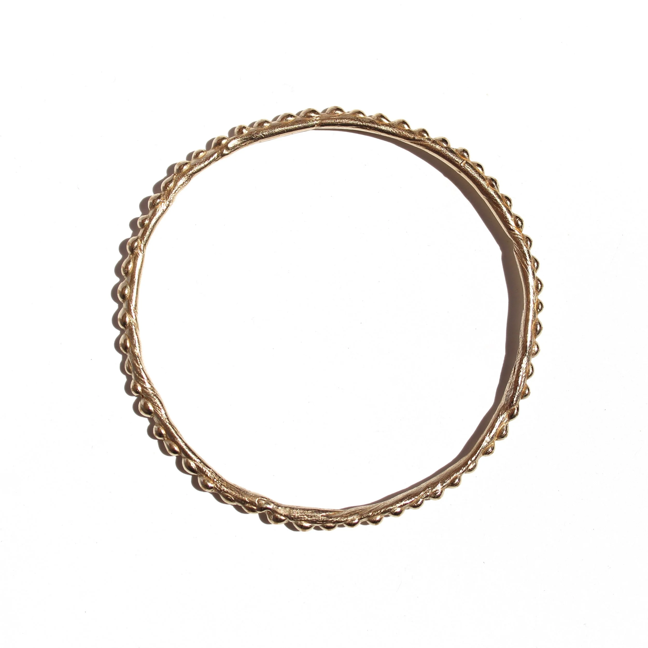 beaded bangle in brass