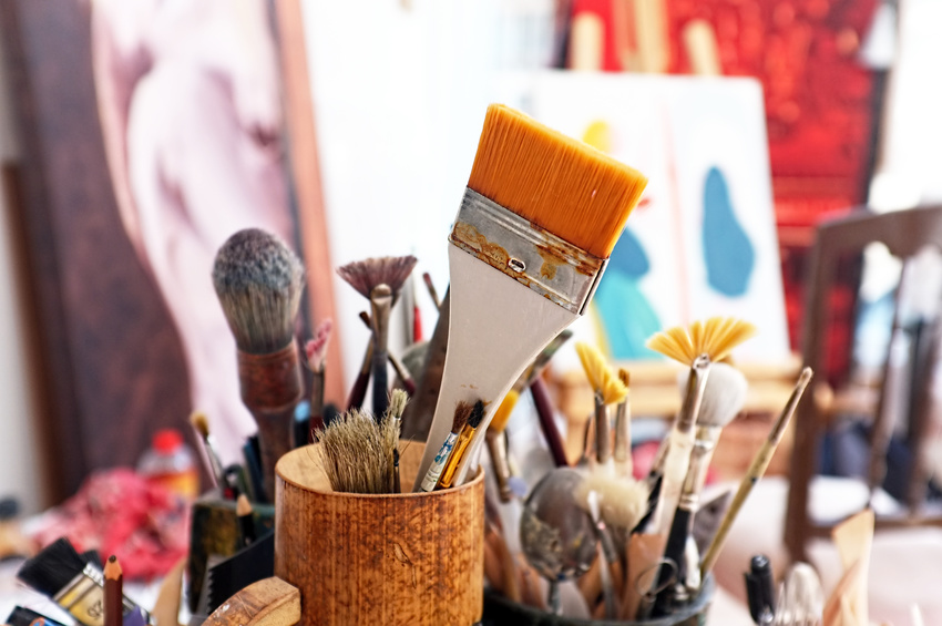 Artist brushes in a studio