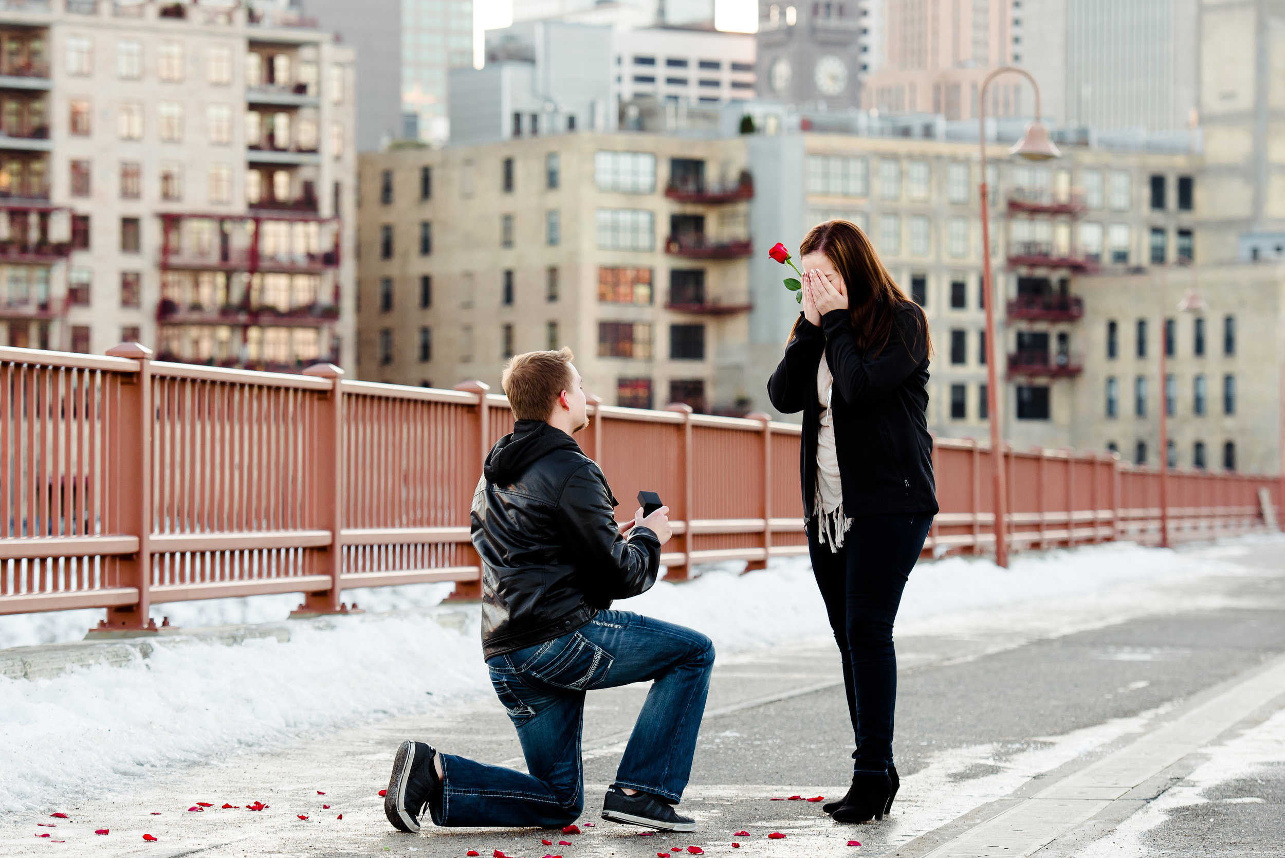 Stone Arch Bridge Emotional Marriage Proposal with Single Rose - Minneapolis Proposal Photographer - MN Wedding Photographer