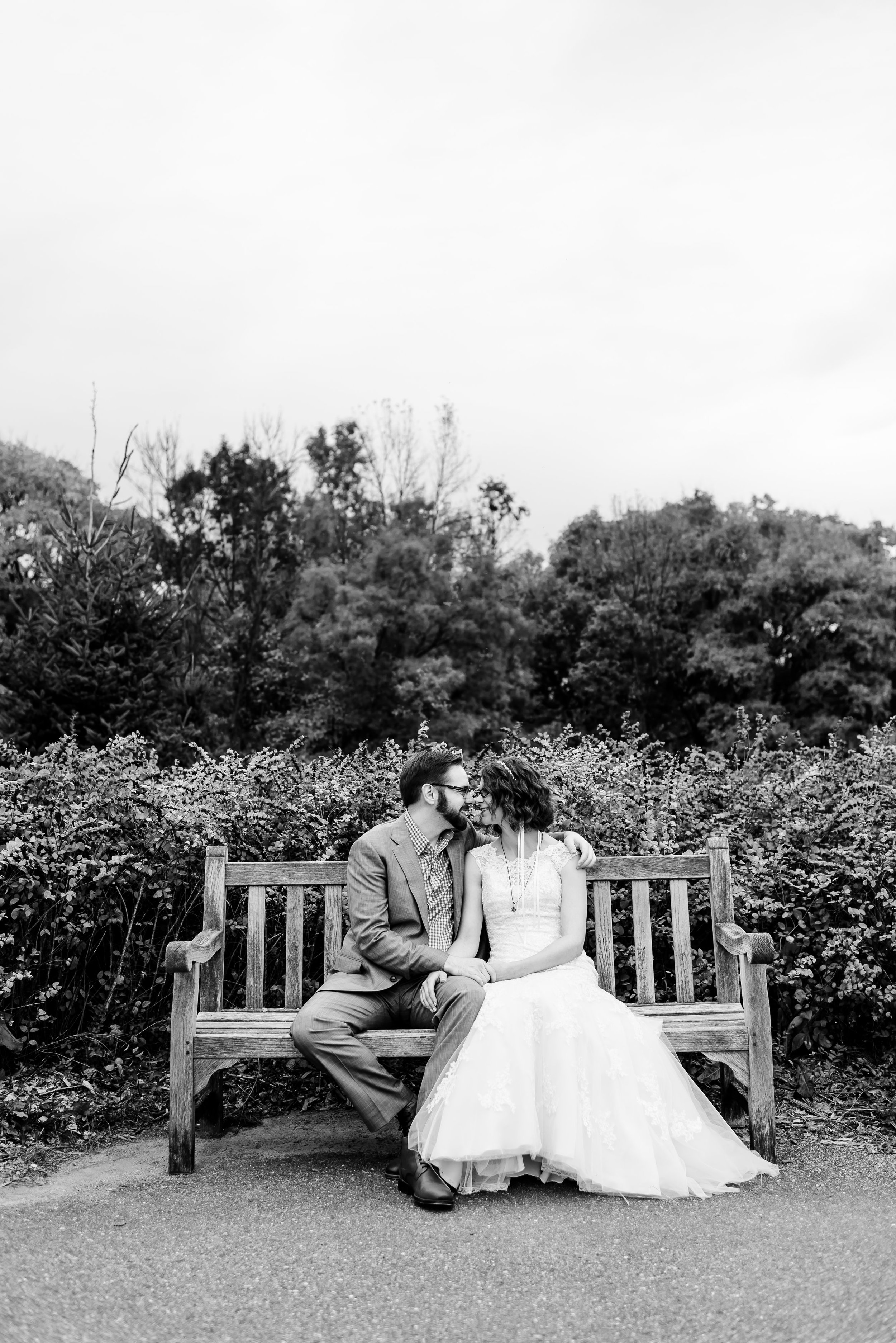 Romantic Bride and Groom Portrait on Bench at Minnesota Landscape Arboretum - Chaska MN Wedding Photographer