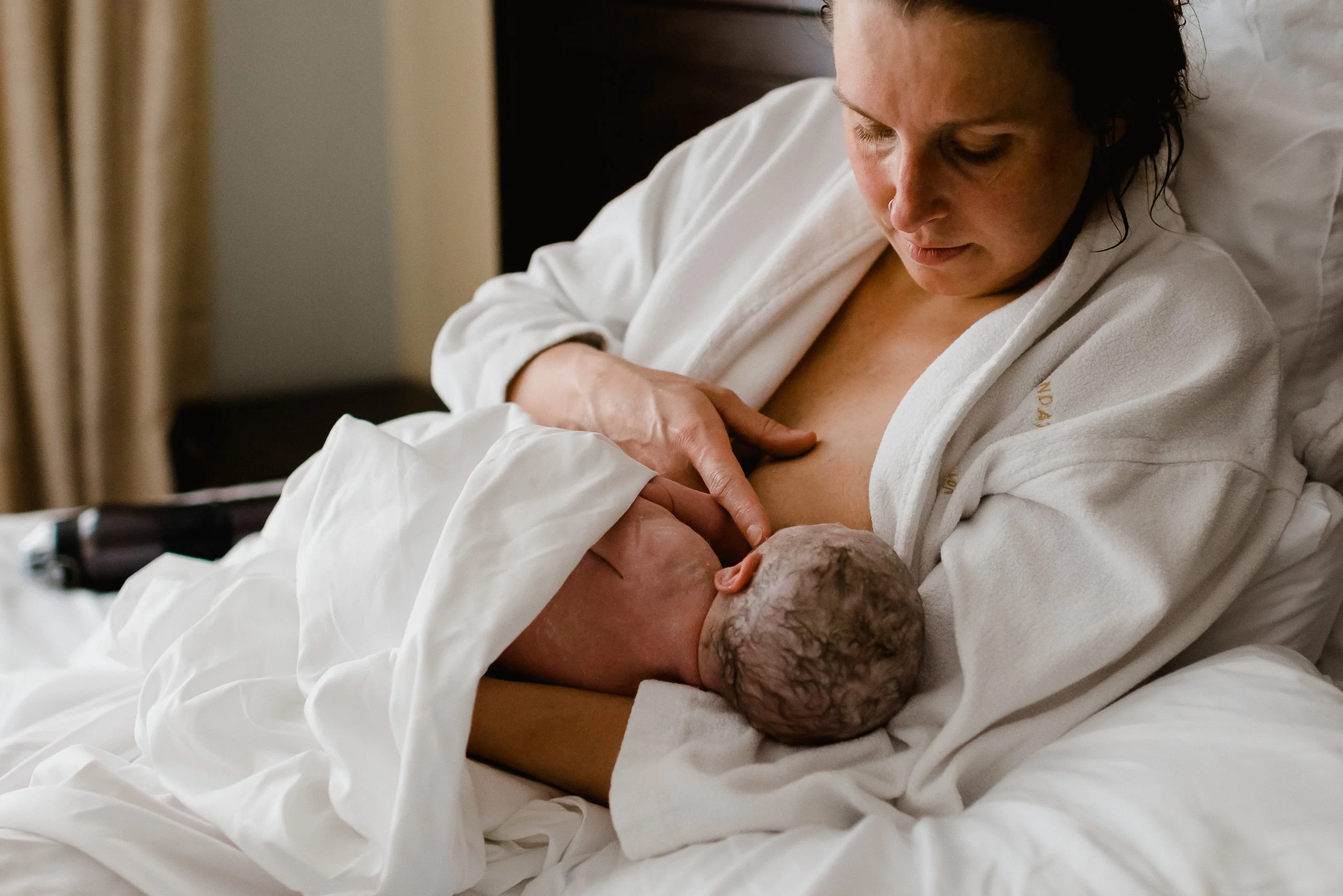 MN Newborn Birth Photographer - Breast Feeding Baby at Health Foundations Birth Center St Paul