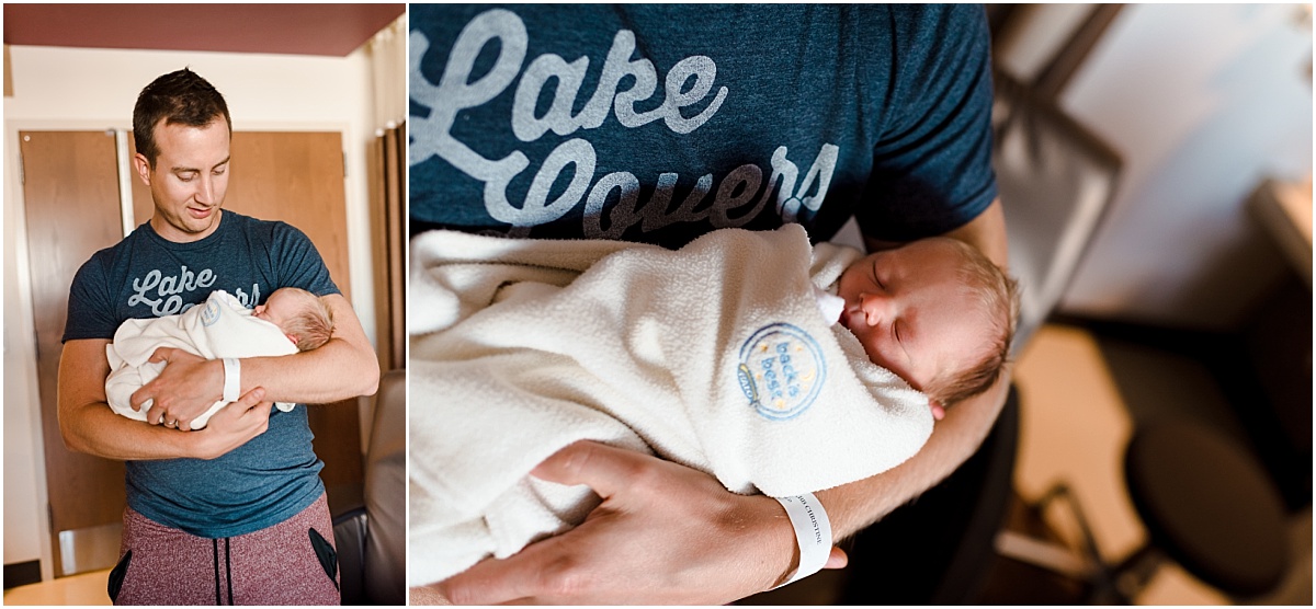 Proud dad holds newborn baby - Twin Cities Newborn Photographer