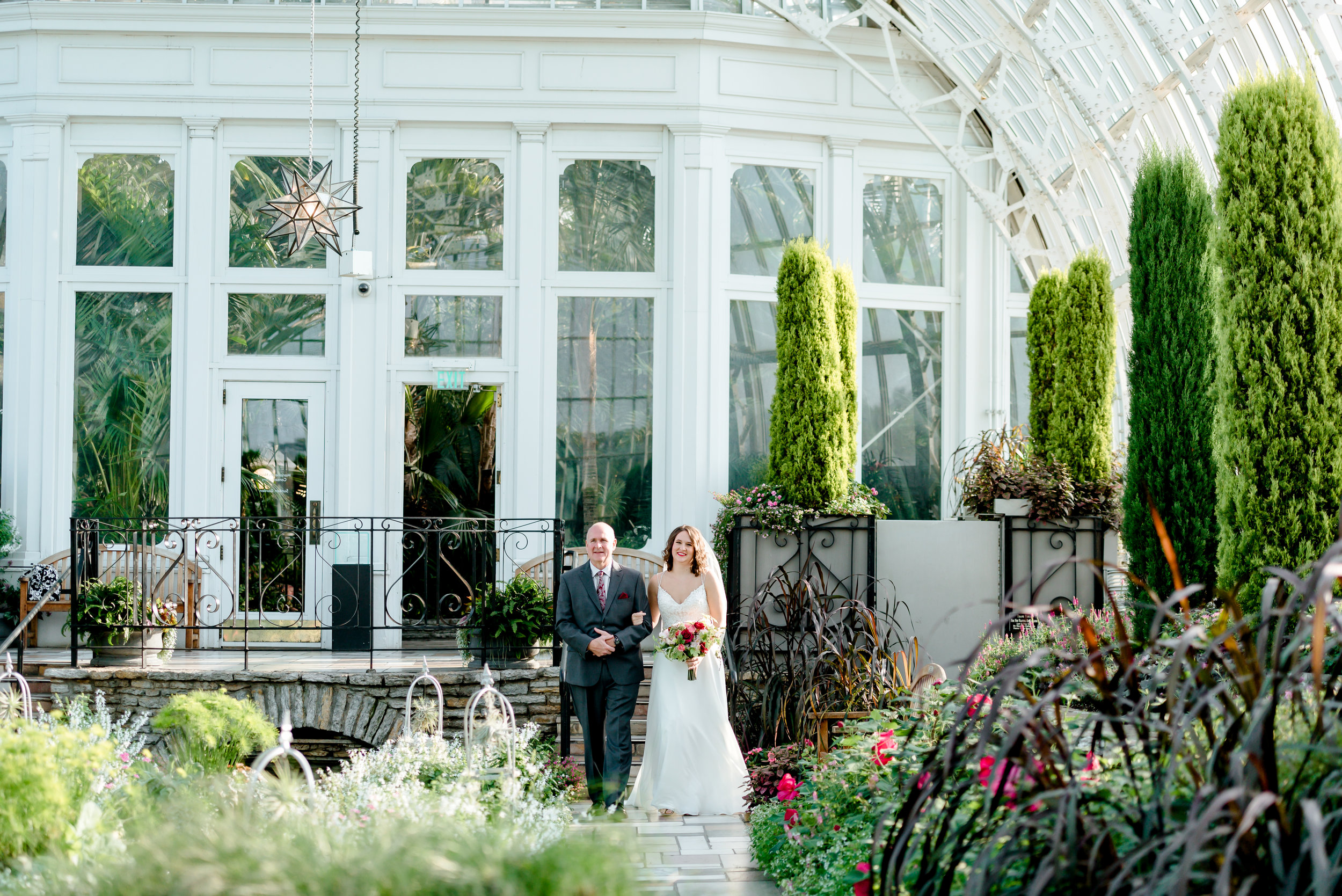 Bride Enters Wedding Ceremony in Sunken Gardens at Como Conservatory - St. Paul Wedding Photographer MN