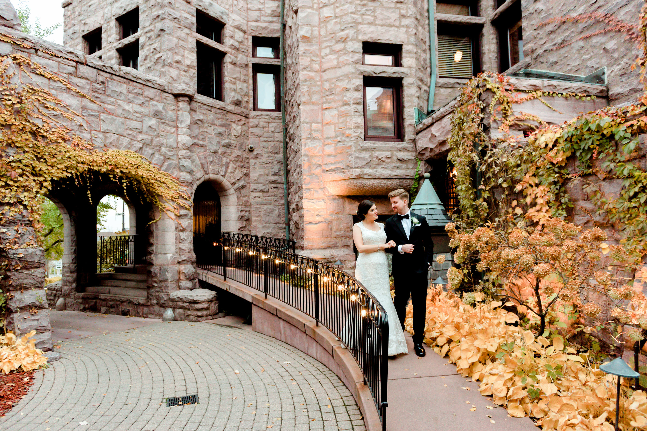 Bride and Groom Walking outside Van Dusen Mansion - Minneapolis Wedding Photographer