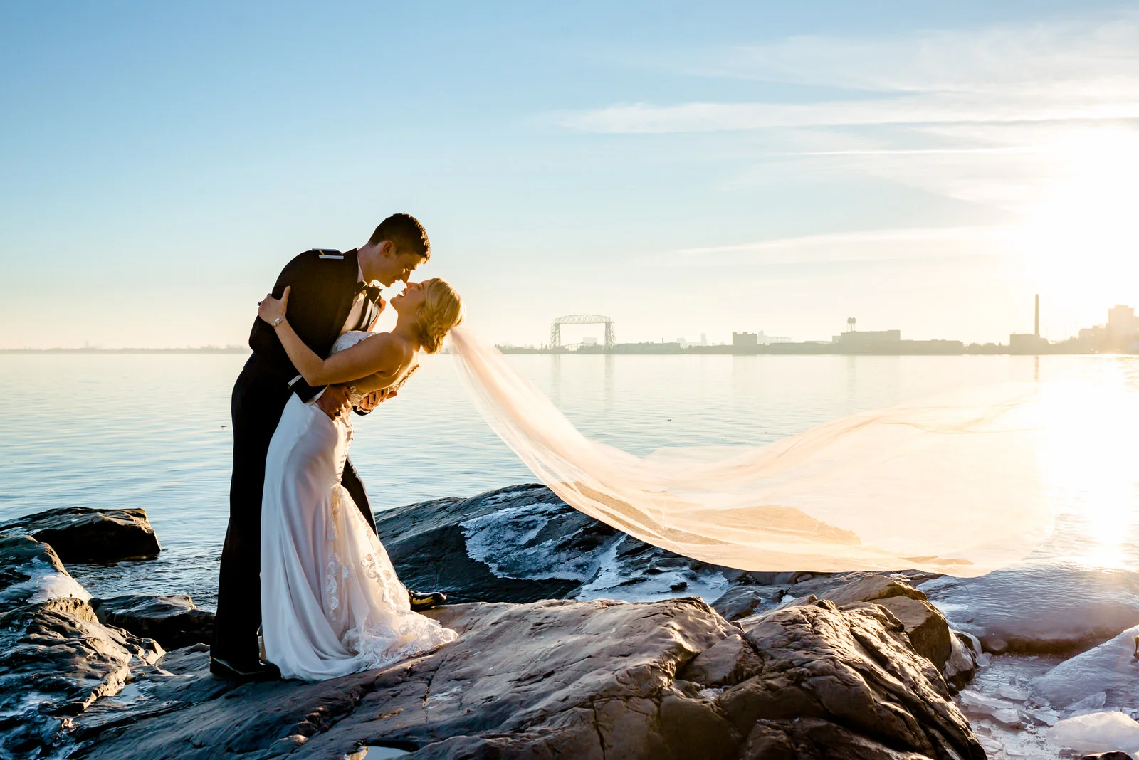 Duluth MN Wedding Photographer - Bride and Groom on Shoreline at Sunset - Romantic Wedding Photos
