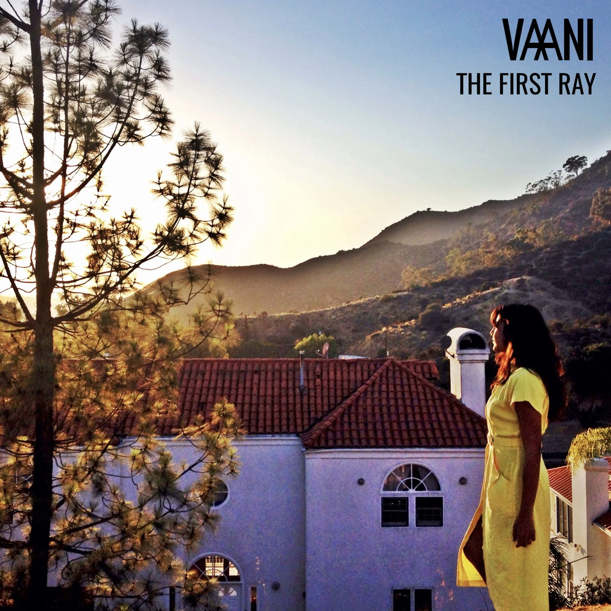 Album cover for The First Ray EP, featuring VAANI on a rooftop gazing at the morning sun.