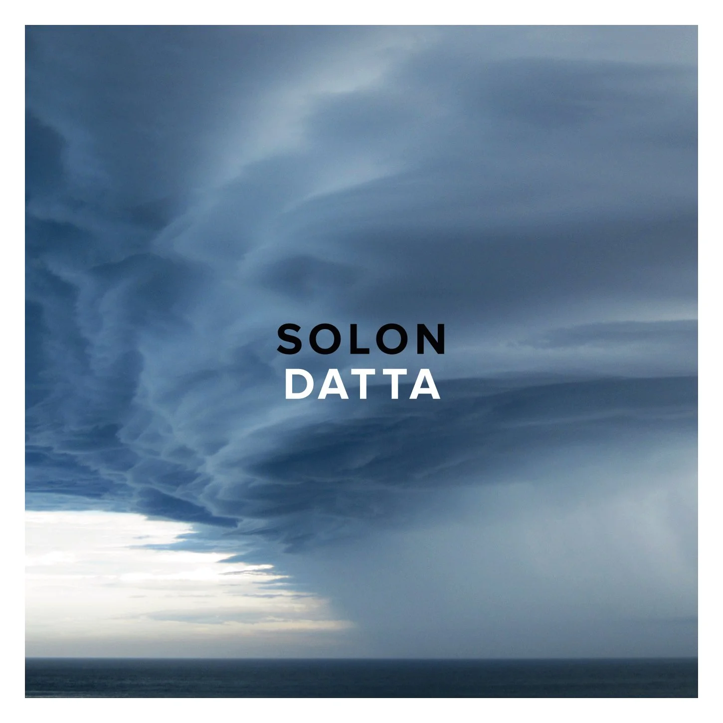 Album artwork for Datta by SOLON, featuring an emerging dark blue cloud front emerging over the ocean.