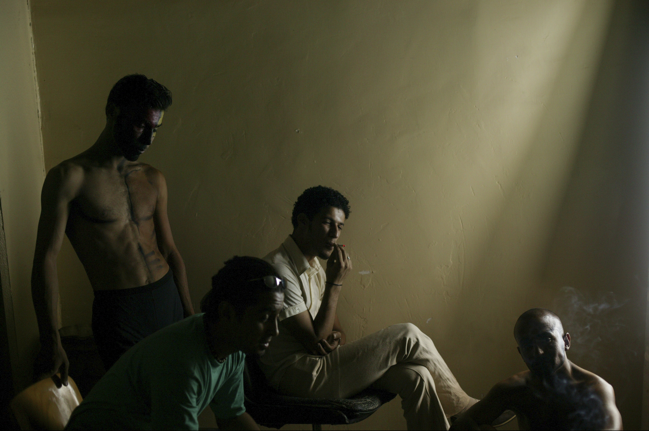 Members of a theater group backstage before a performance.