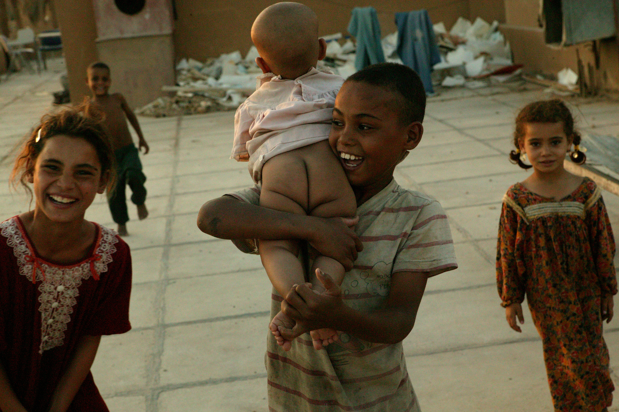  Children playing on a Baghdad rooftop. 