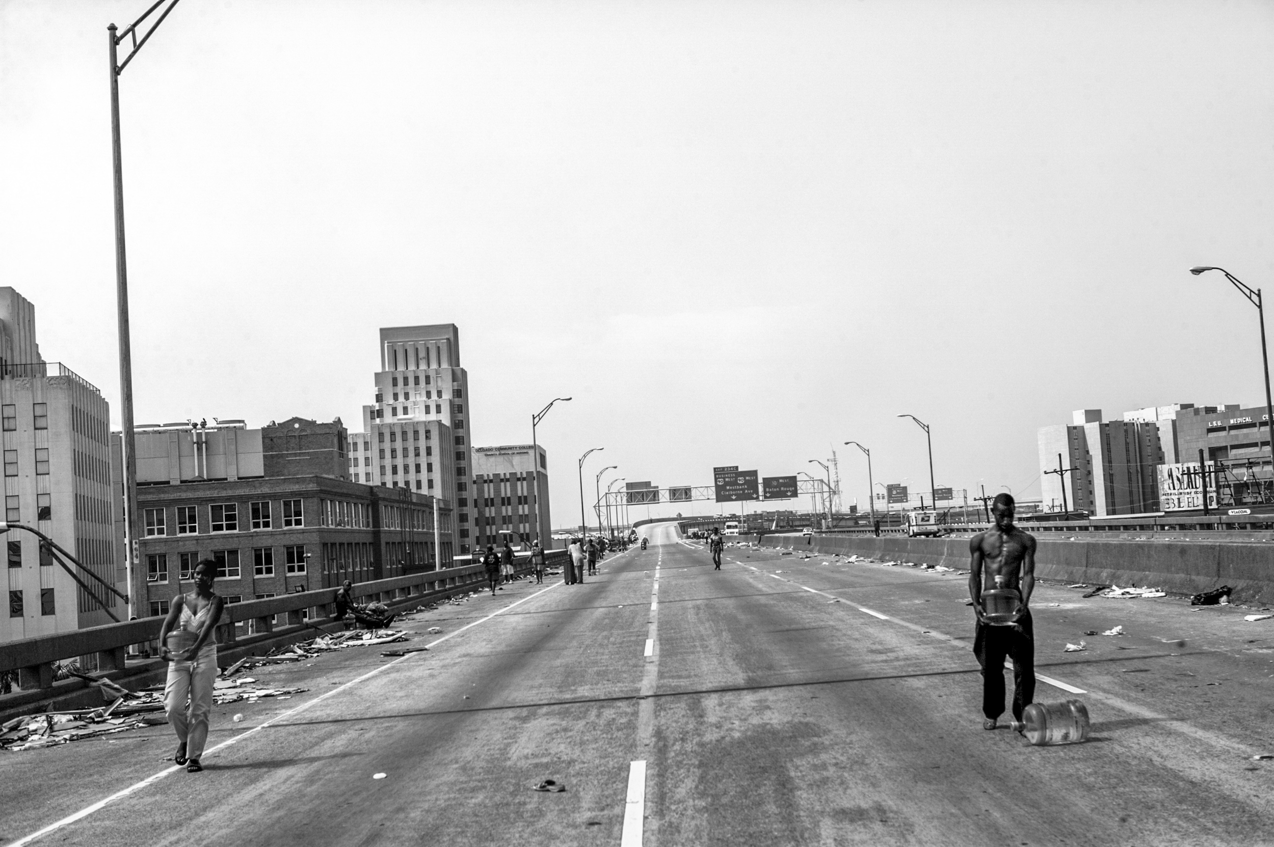 For up to four days almost 300 New Orleans residents, mostly African Americans, were stranded on Interstate 10 until they were finally rescued by aid helicopters. During the four days on this asphalt camp they ran out of water, food and medicine. Pe