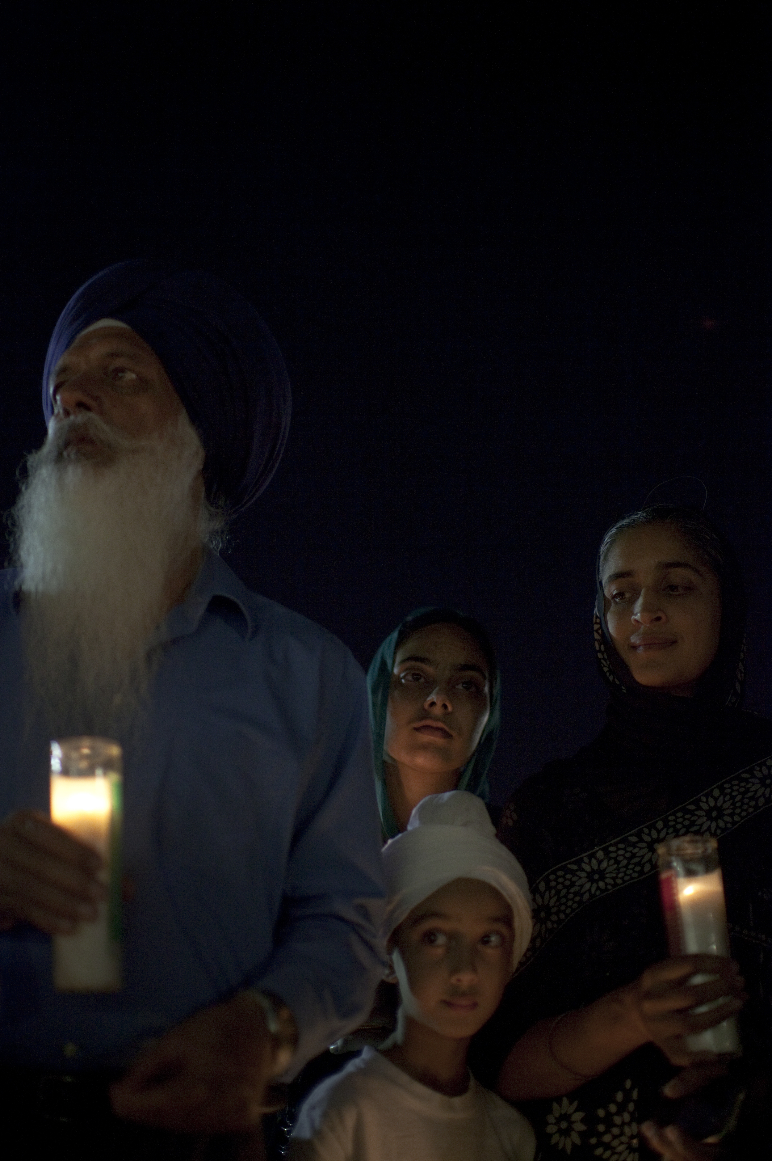  A family of the Sikh faith gathered at a candlelight vigil for six&nbsp;worshipers who were shot and killed&nbsp;at&nbsp;a Temple in Wisconsin by a white supremacist. 