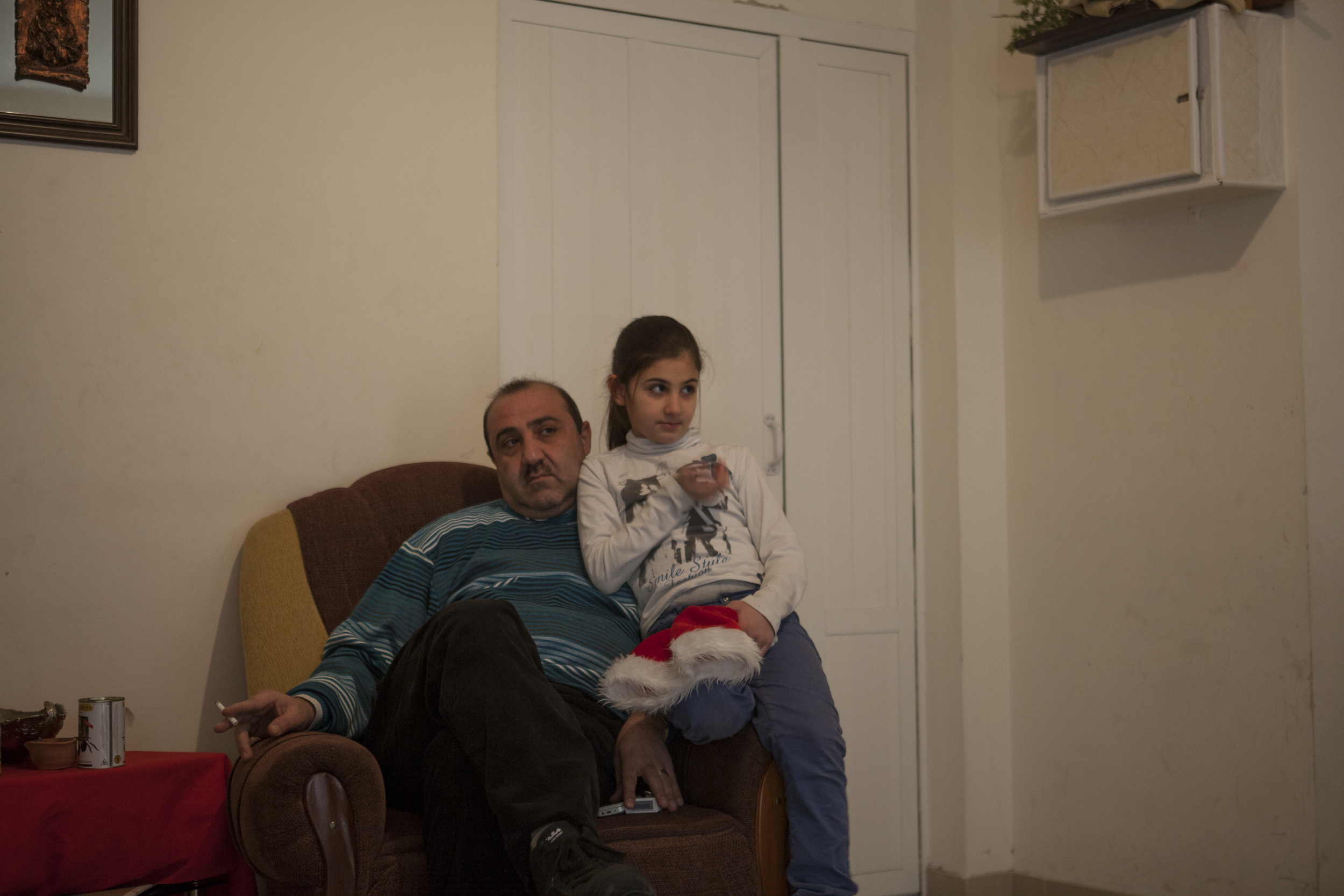  Many Syrian-Armenians fled to Yerevan - Armenia's capital. A father and daughter sit together in an apartment donated by the Catholic Church for the most desperate. 