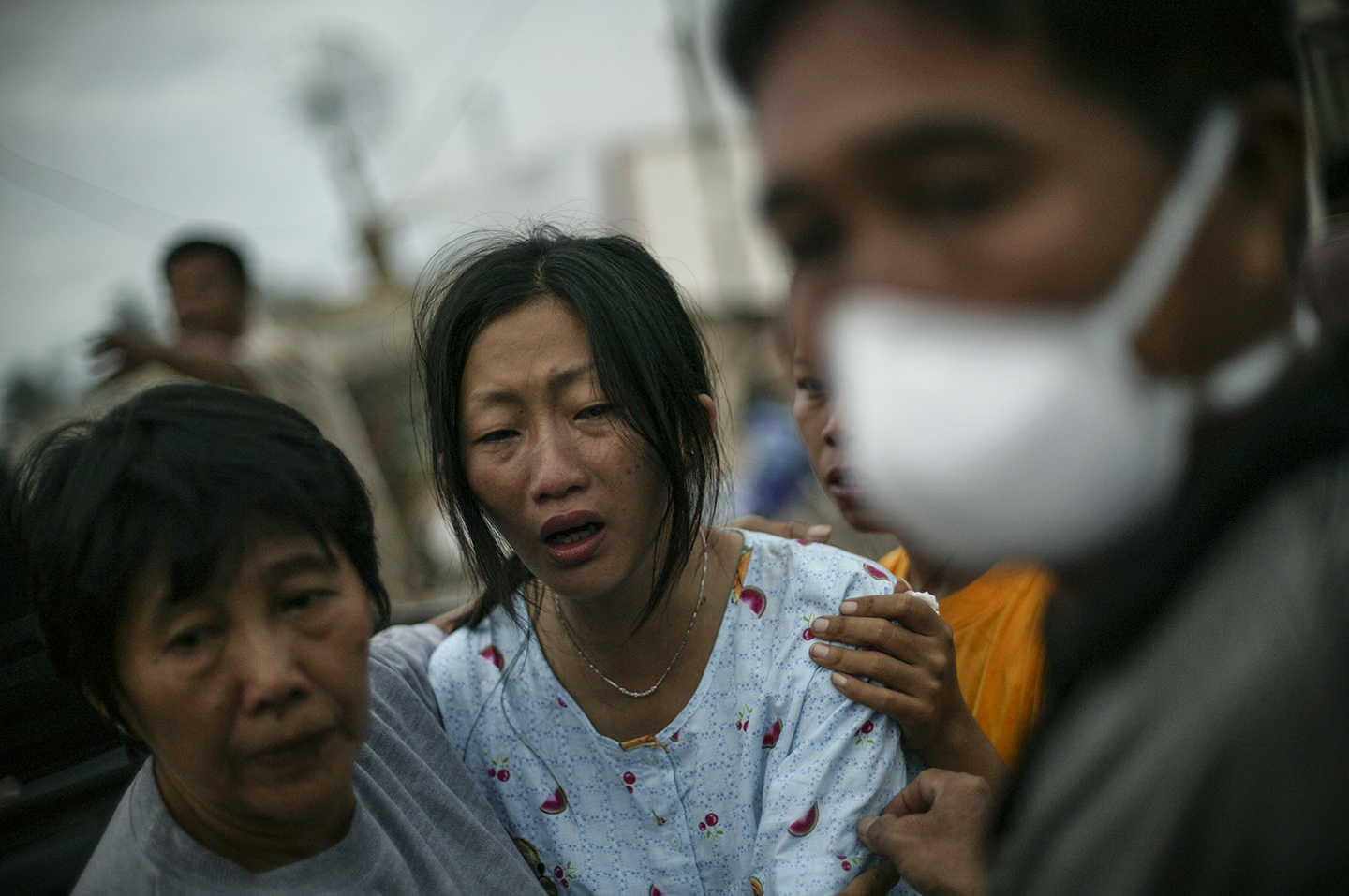  A woman grieves the loss of a loved one. 