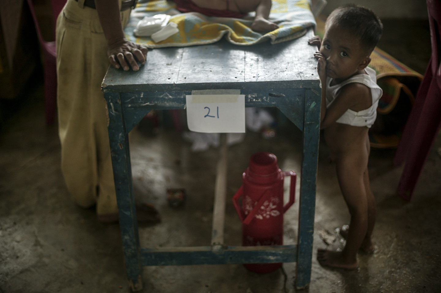  A boy stands in his own diarrhea as he waits for treatment.&nbsp; 