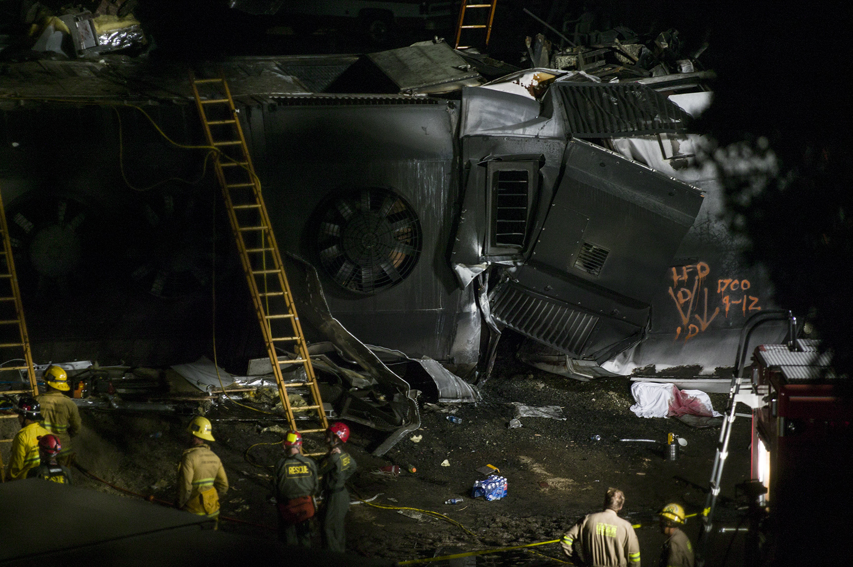 Emergency workers search for survivors at the site of a deadly train collision between a Union Pacific freight train and a Metrolink commuter train.
