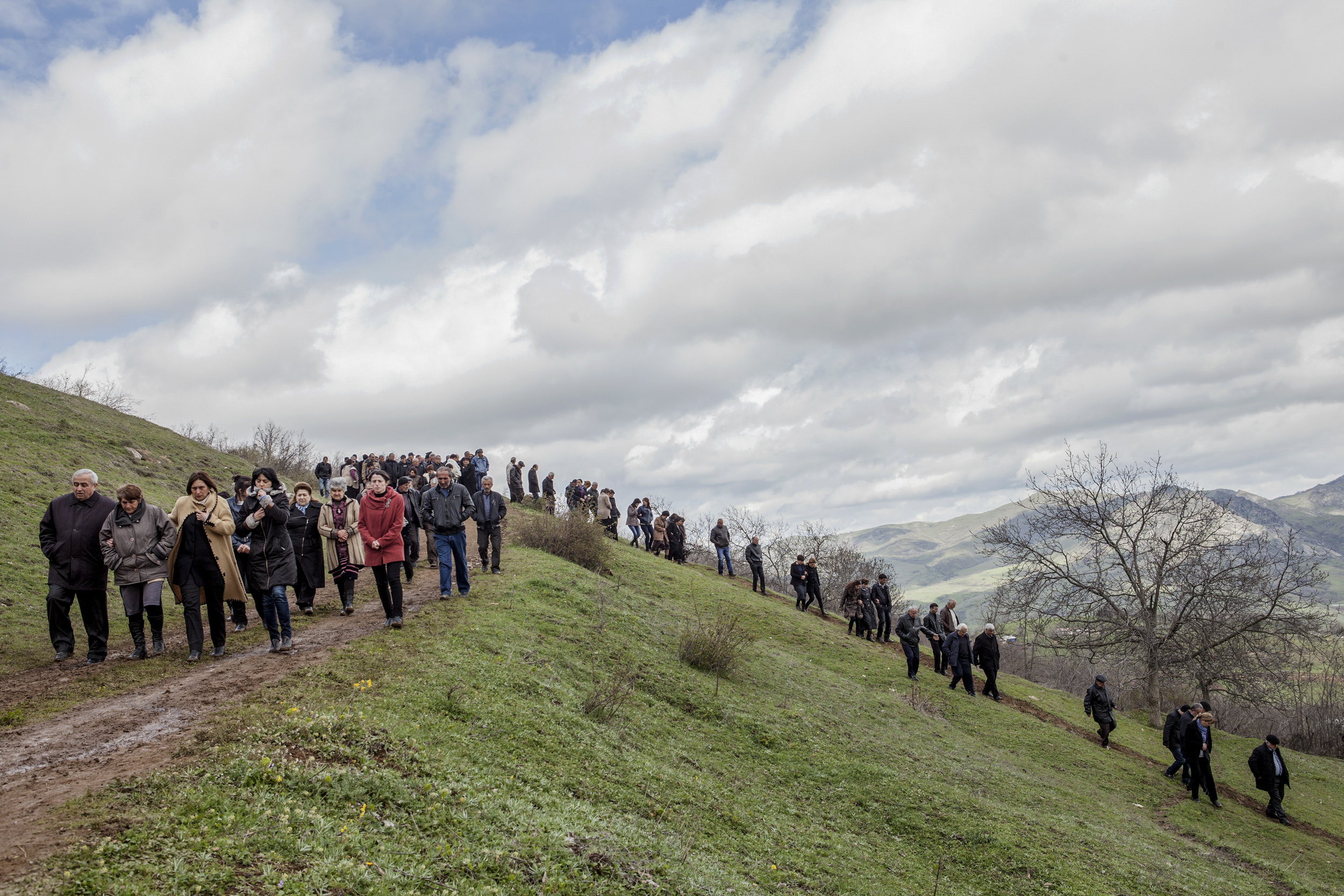 Locals of Herher village depart after funeral services for a boy killed on April 2 when Azeri Grad rockets hit their village during the first day of fighting.