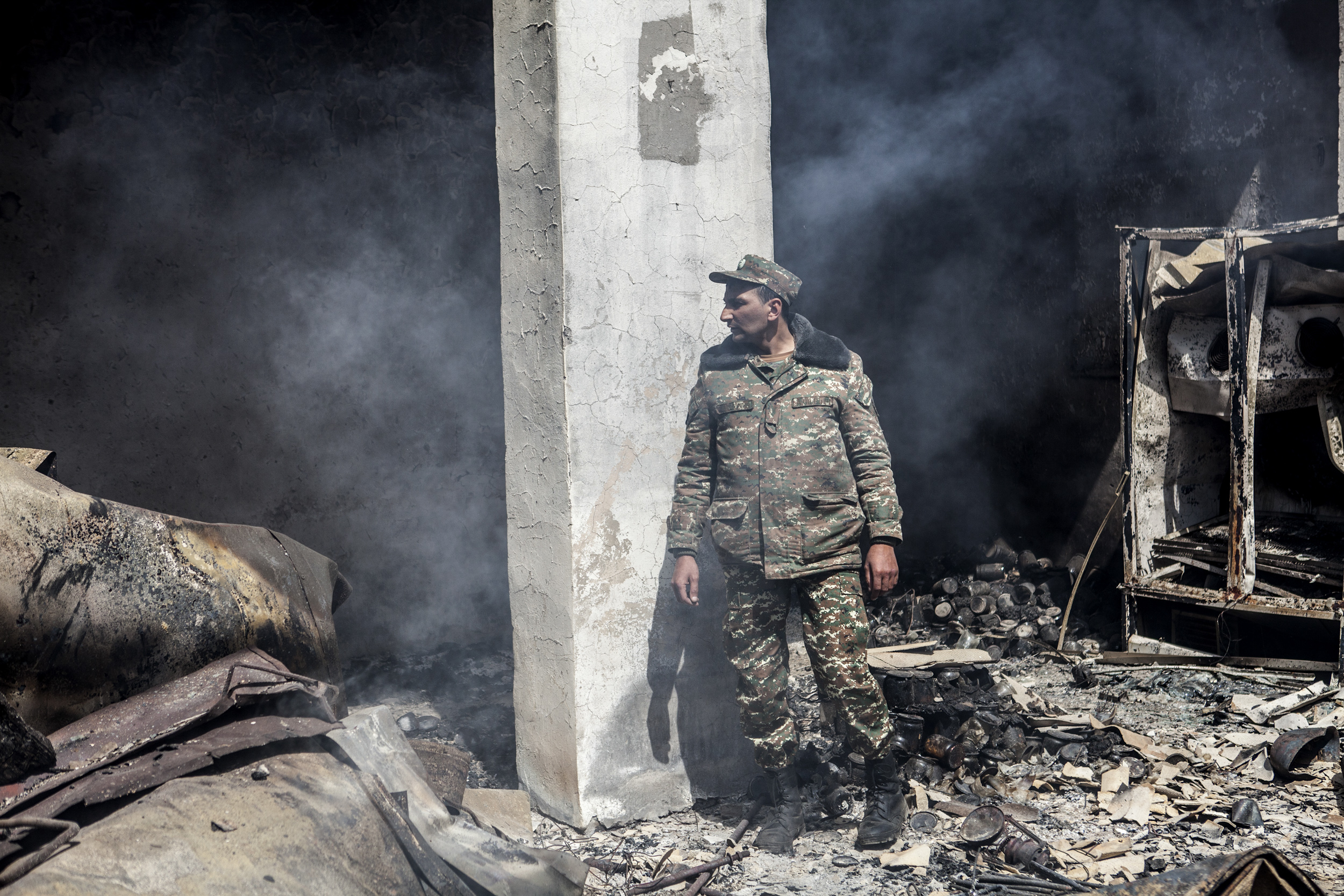  April 5 - an Armenian servicemen in a recently hit building on a base in Mataghis. 