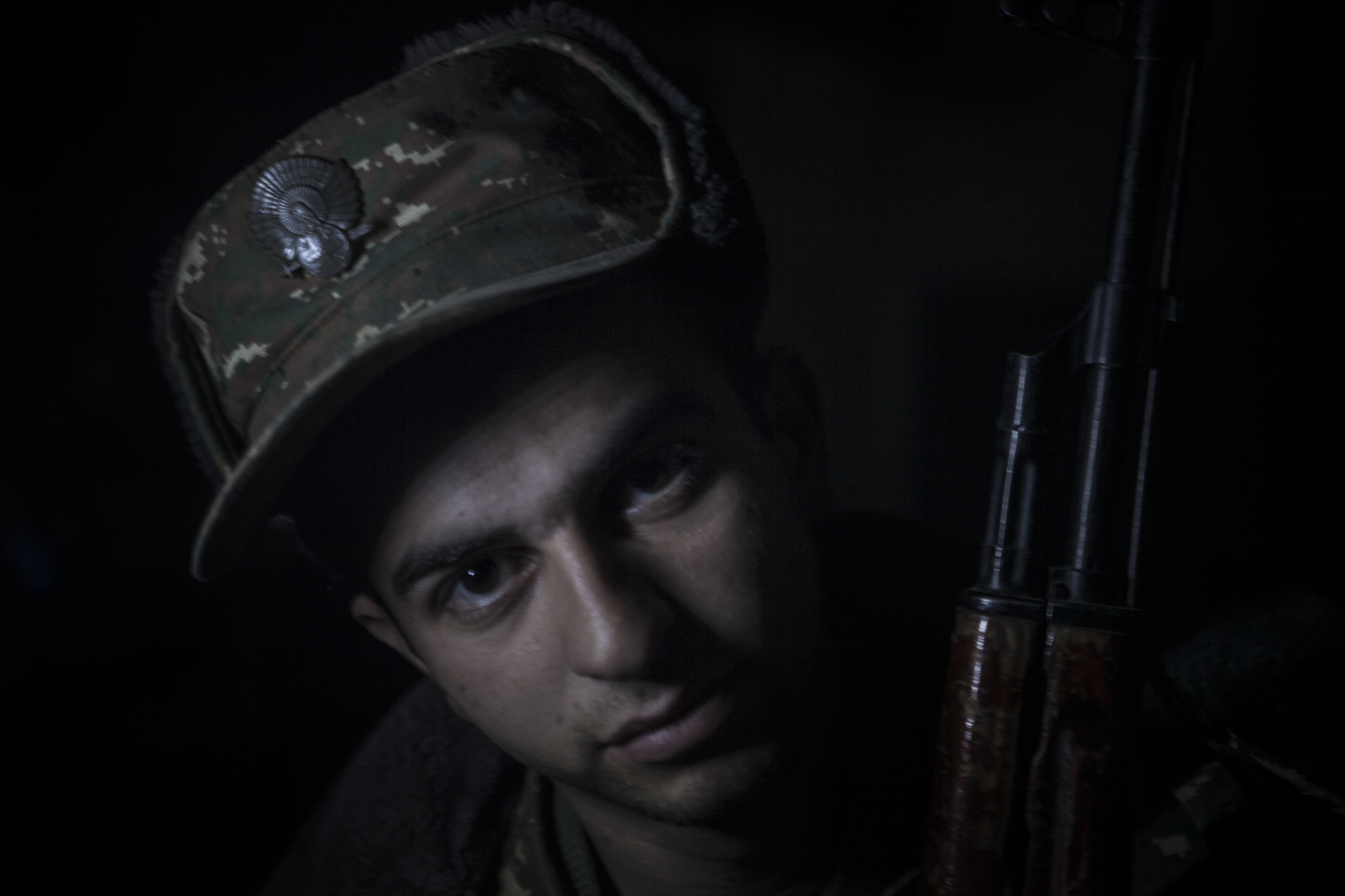  Soldiers awaiting orders in darkness, lit only by kerosene lanterns, at a military base in Mataghis, Karabakh on April 5. 