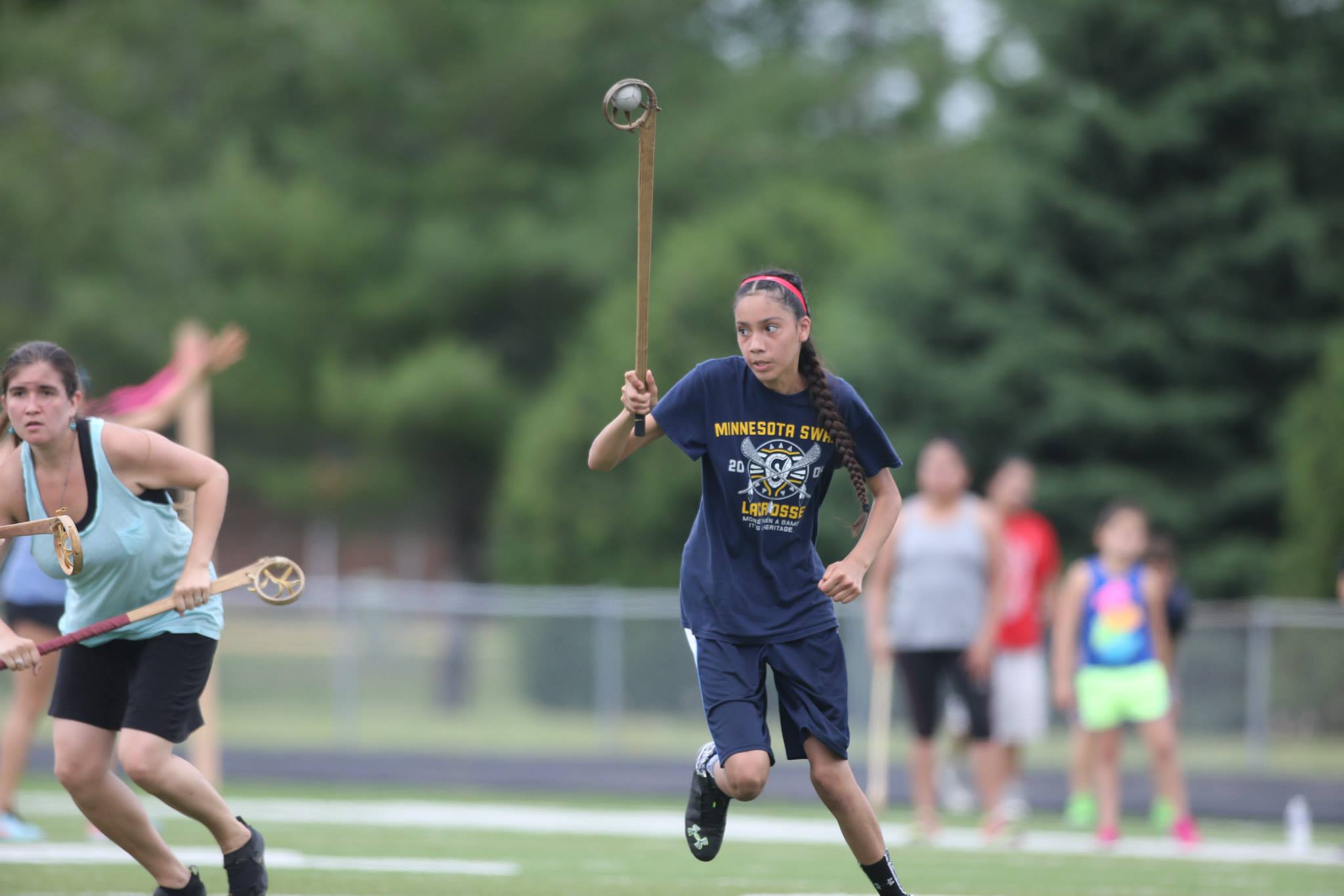  Eighth grader Nina Polk competes in the 215 wooden stick tournament. Nina and her mother, Dyani Whitehawk, are members of the adult women's team.&nbsp; 