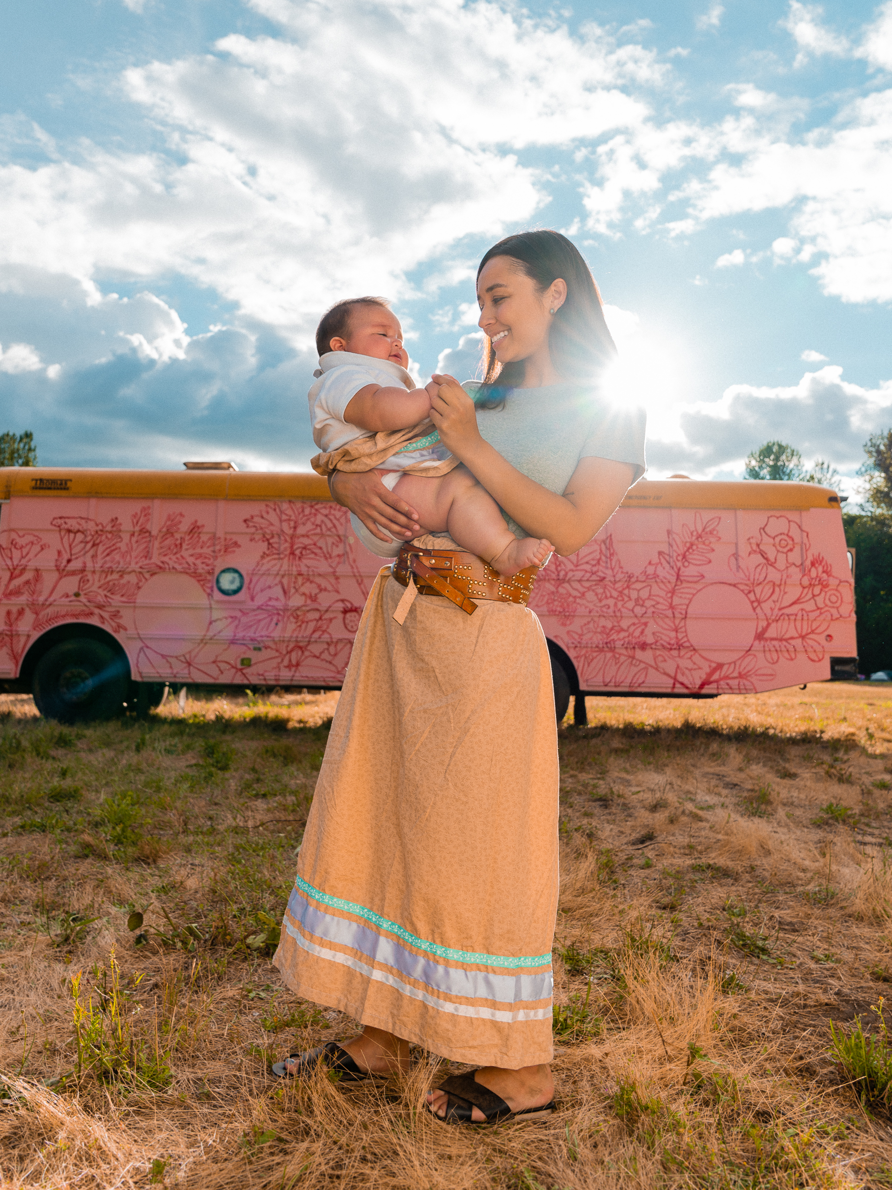 Chelsey & Alo wearing matching ribbon skirts made by grandma Donna at the Indigenous Environmental Network Protecting Mother Earth conference on Nisqually territory. Photo by Tomas Carmelo Amaya aka Tio.