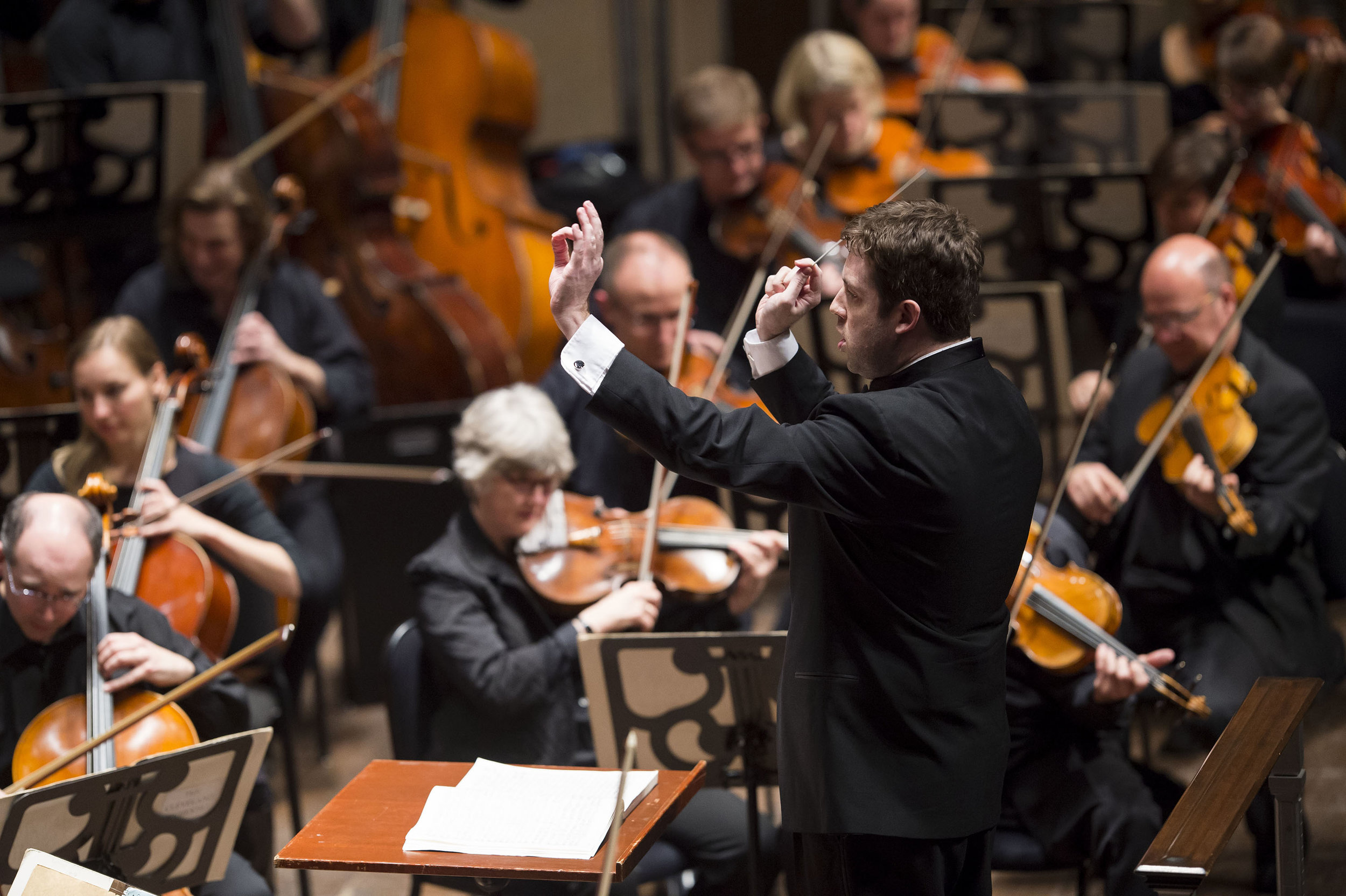On his second-to-last scheduled subscription appearance before becoming music director of the Colorado Symphony, Cleveland Orchestra associate conductor Brett Mitchell (seen here in March 2014) demonstrates once more the strength of his commitment to American music with a program of works by Bernstein, Copland, and Augusta Read Thomas. (Photo by Roger Mastroianni)