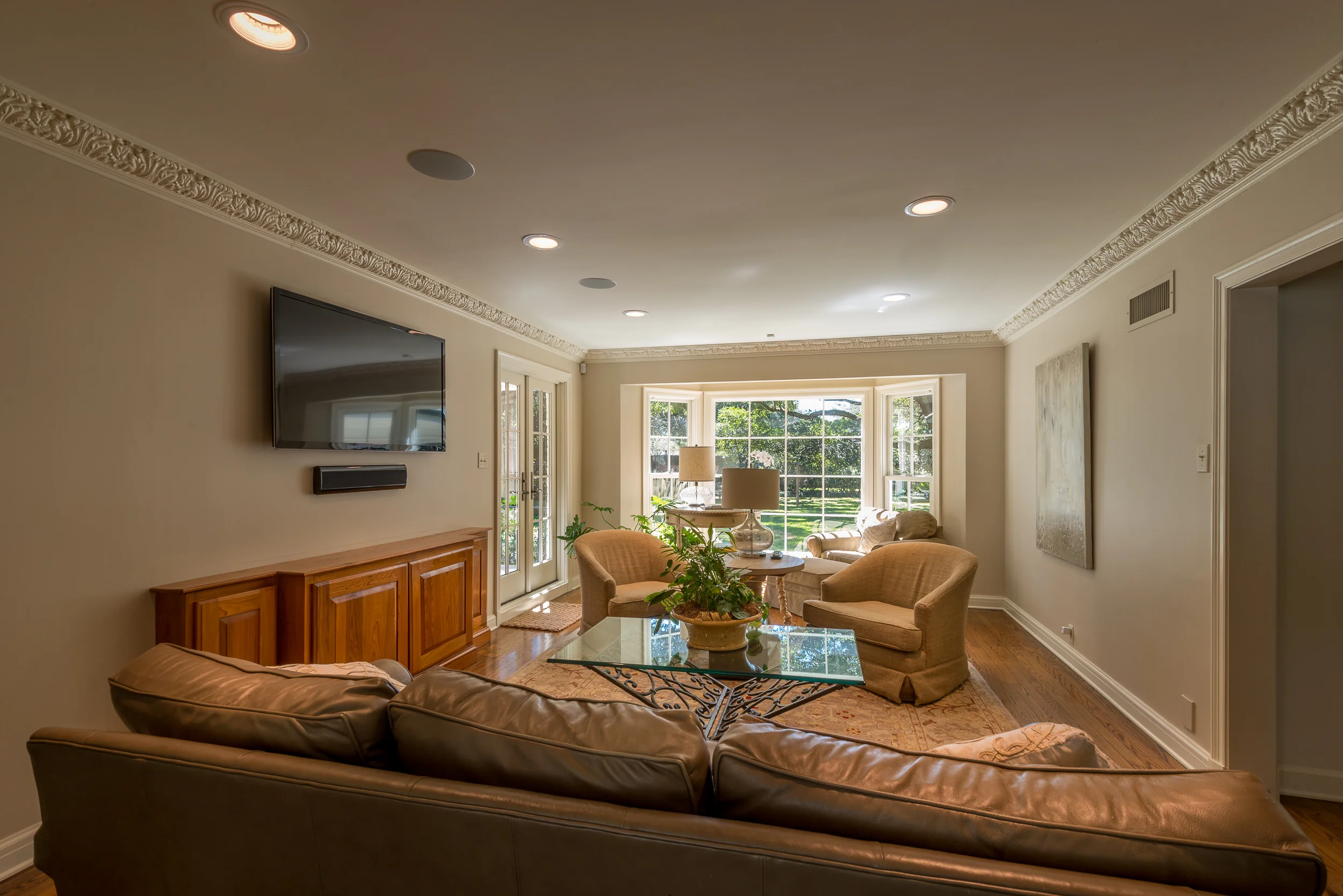 A Panasonic 46" full-array LED TV and a Pinnacle Wafer Series sound bar provide excellent sound and vision for this Houma residence.  The cabinet houses the home's dual zone sound system and powerful Velodyne subwoofer for theater-like sound.