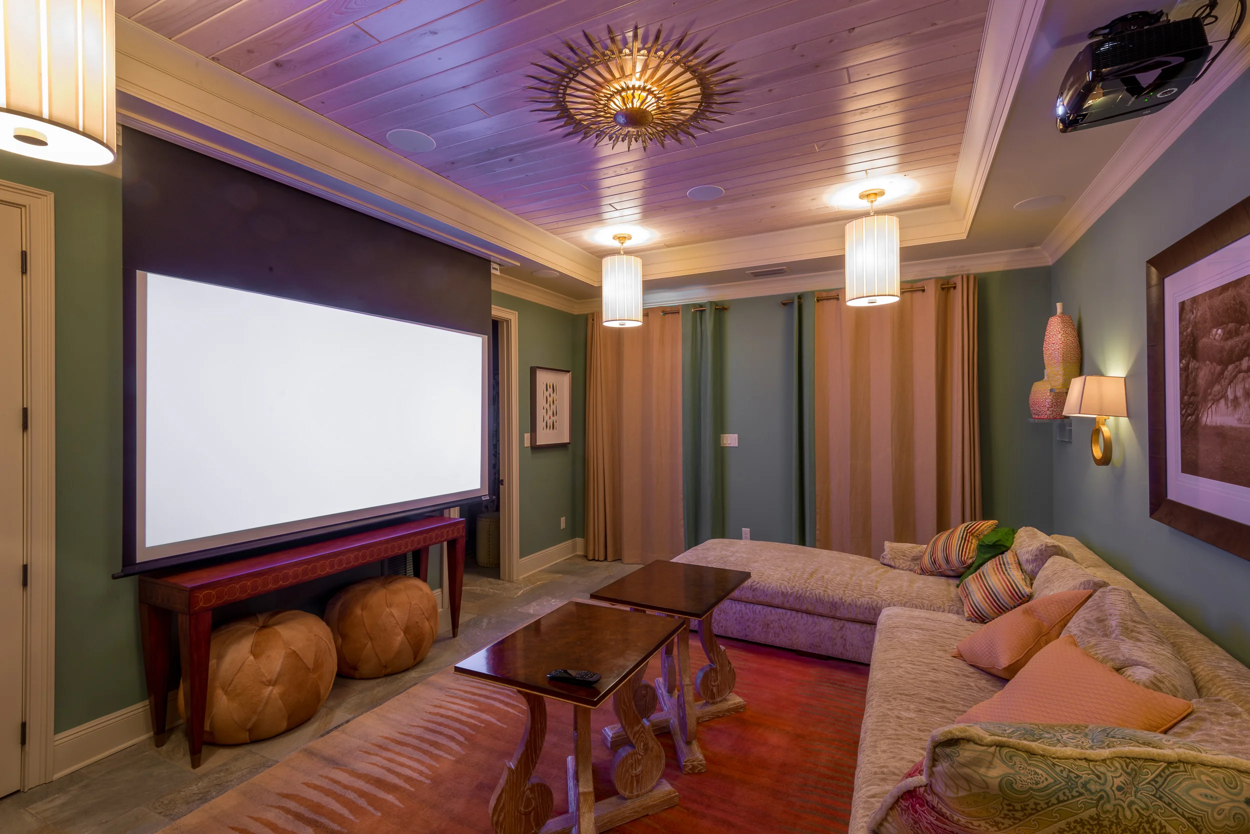The piece de résistance of this residence is the designated theater room. The impressive audio/video system remains unheard and out-of-sight until the massive Vutec 103" motorized film screen drops out of the ceiling.  That's when jaws drop too…