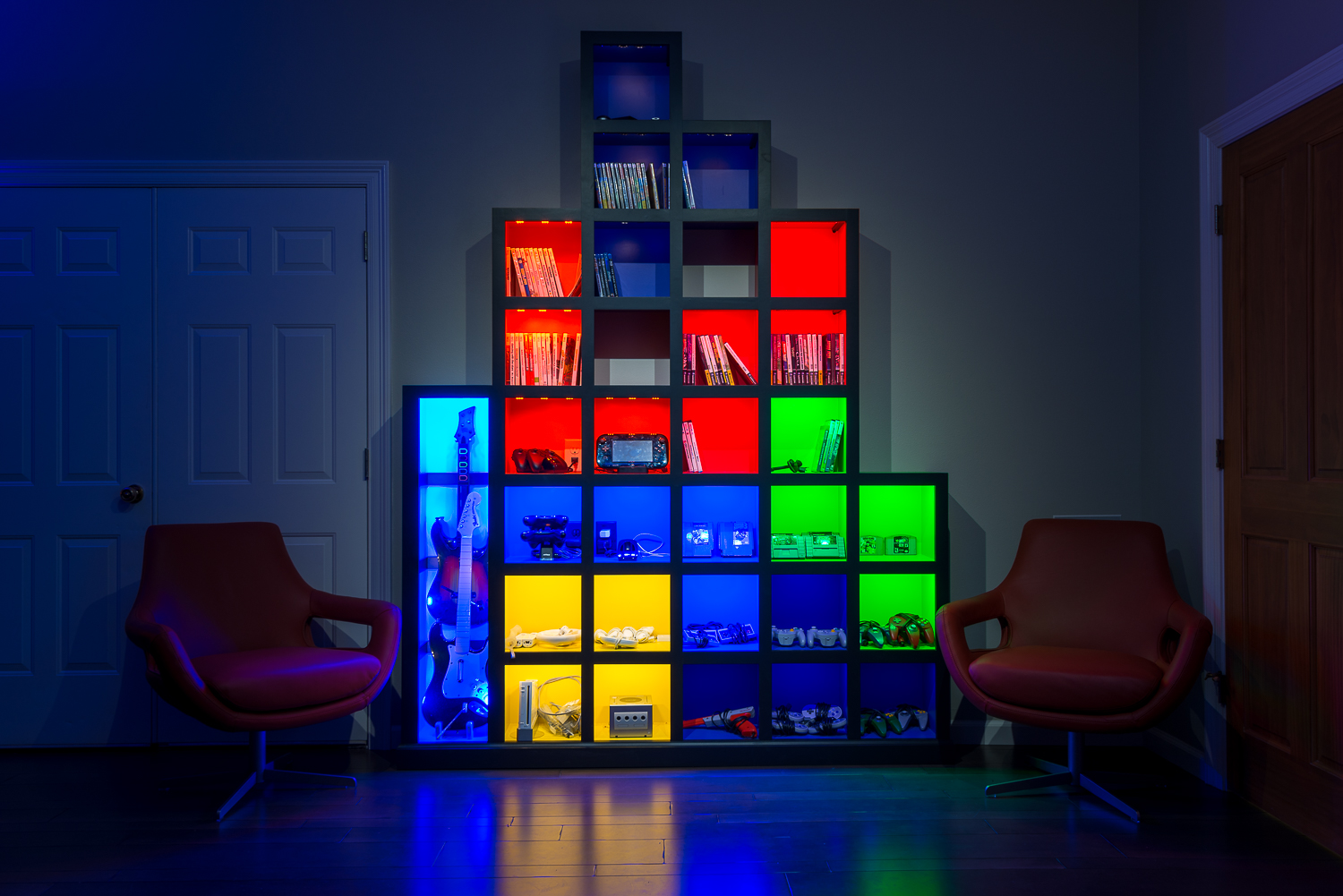 The room's "Tetris Wall" stores all of the controllers, gaming discs and cartridges.