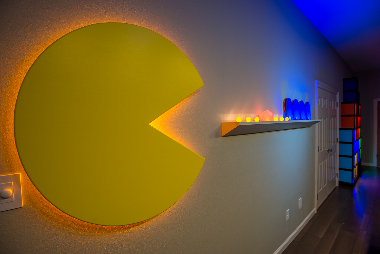 Strategically placed LED ambiance lighting illuminate the ping pong balls and paddles.