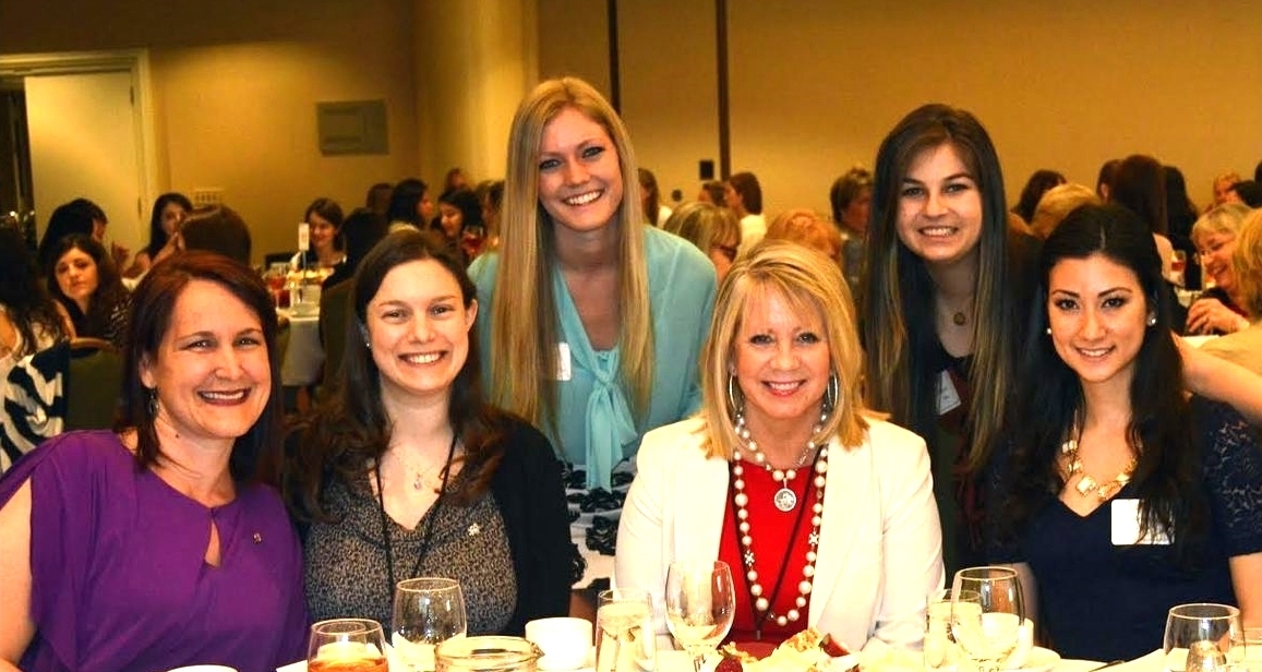 Collegiate members pose with alumnae and former Alpha Phi International President, Linda Boland, at our 125th Anniversary Celebration Luncheon. 