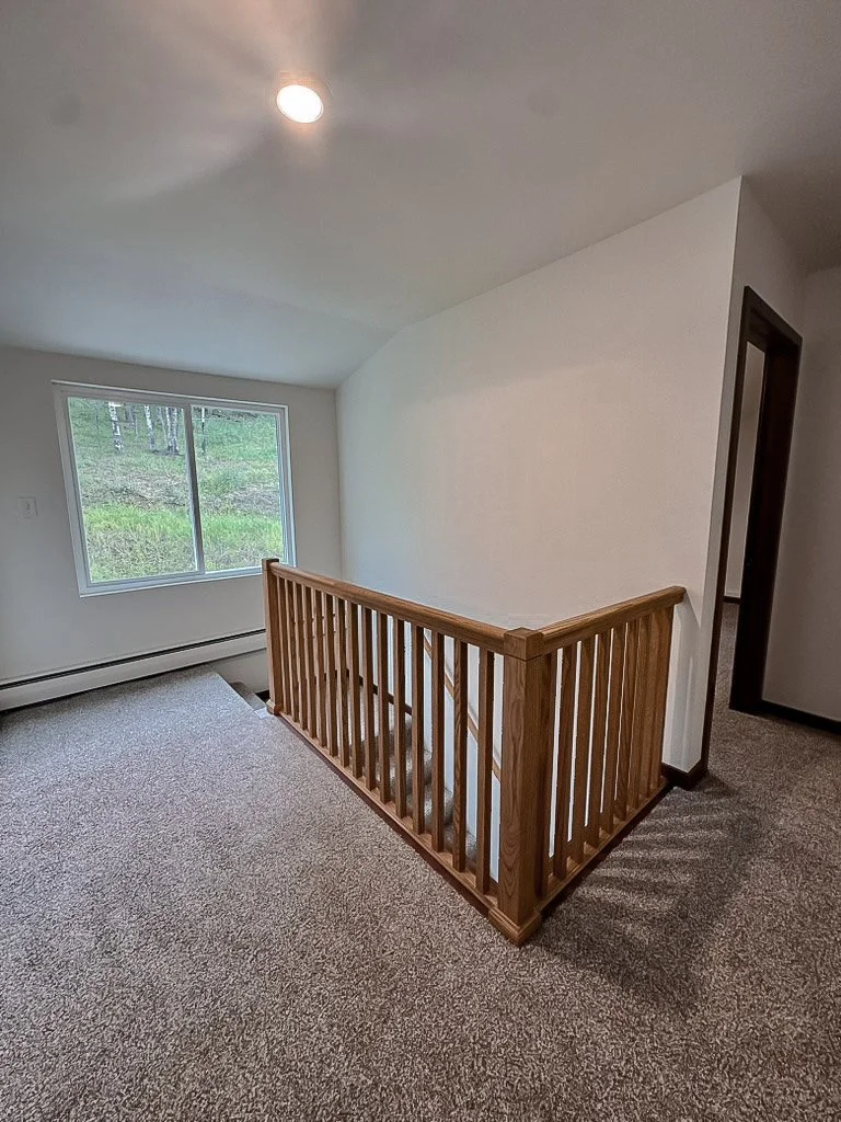 upstairs landing with office door on left and bedroom on right