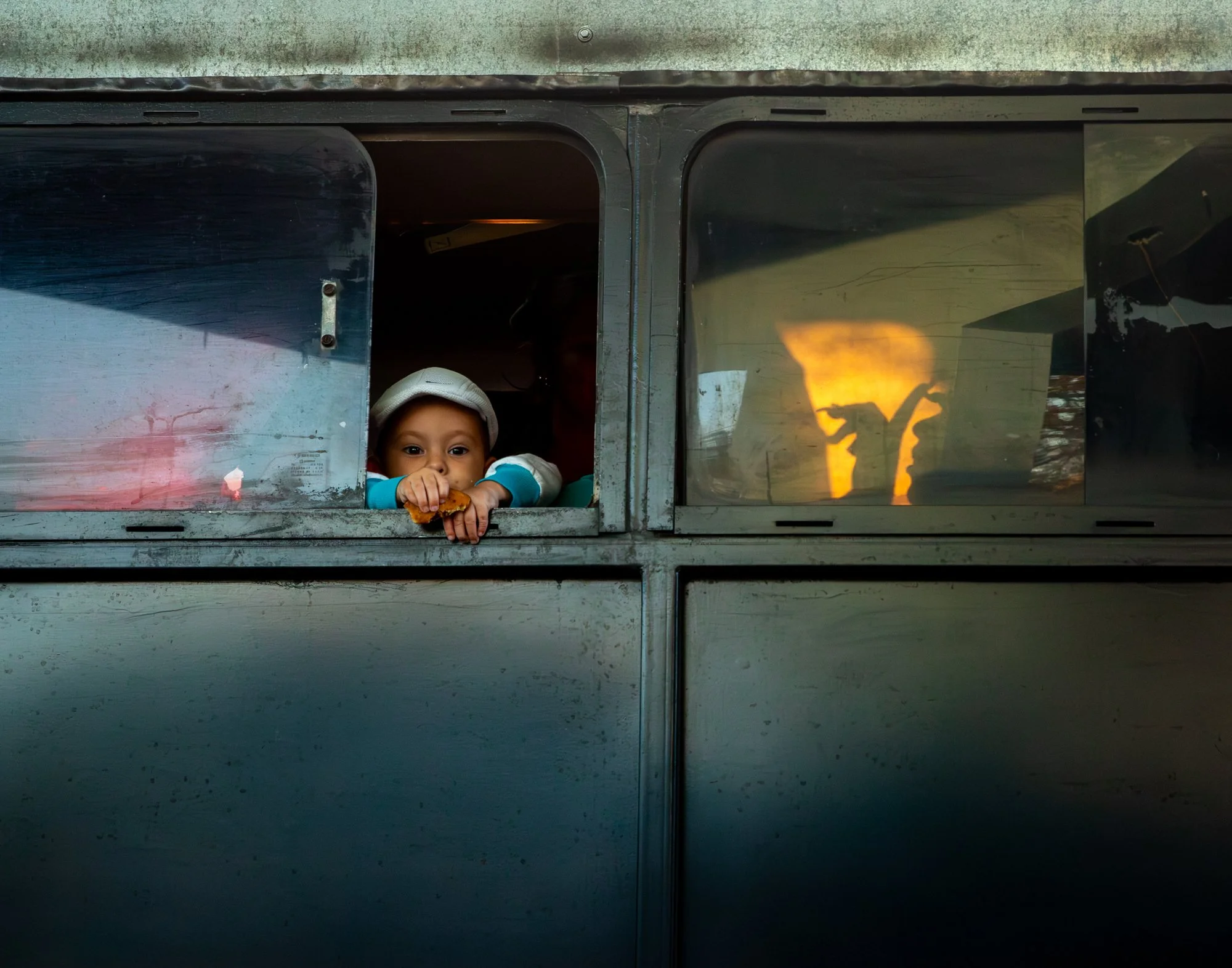 Faces on a Train by Sally Harris