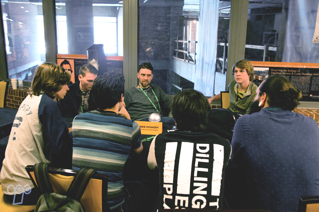 Mike Mowery, CEO of Outerloop Management & Outerloop Records, speaking with a band during LAUNCH's Mentoring session.