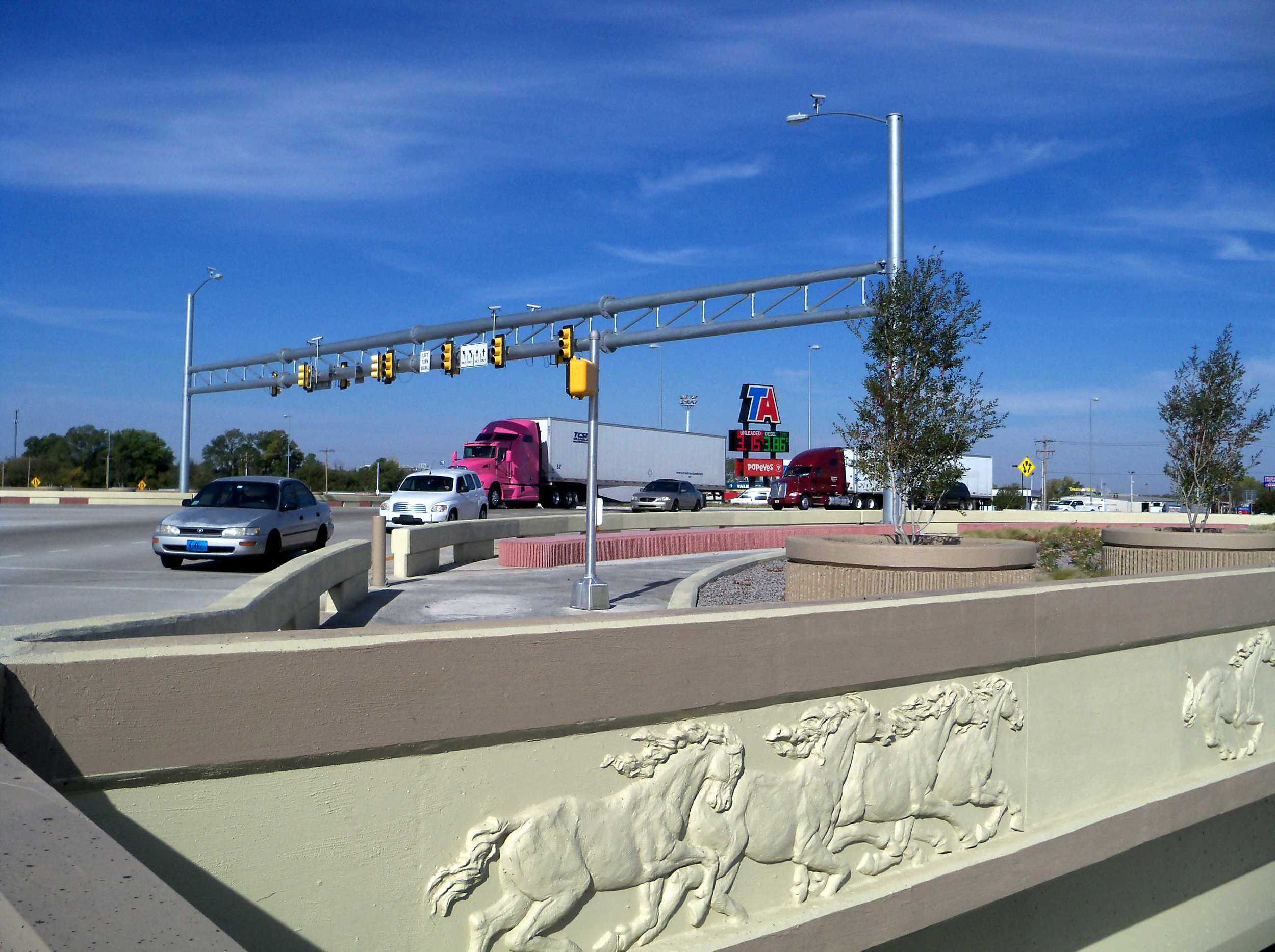 6.I-40 MorganRoad SPUI Completed Bridge Signal w Art Landscaping.jpg