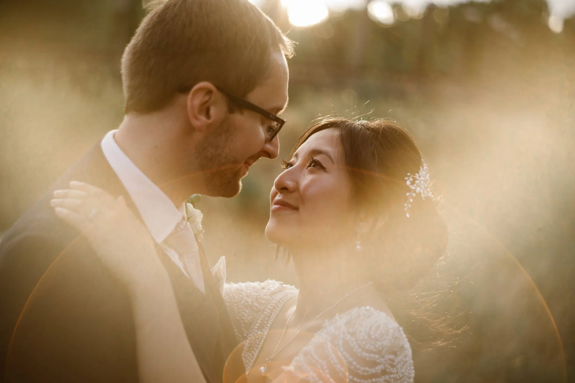 Photo of a bride and a groom in the golden light taken by a wedding photographer