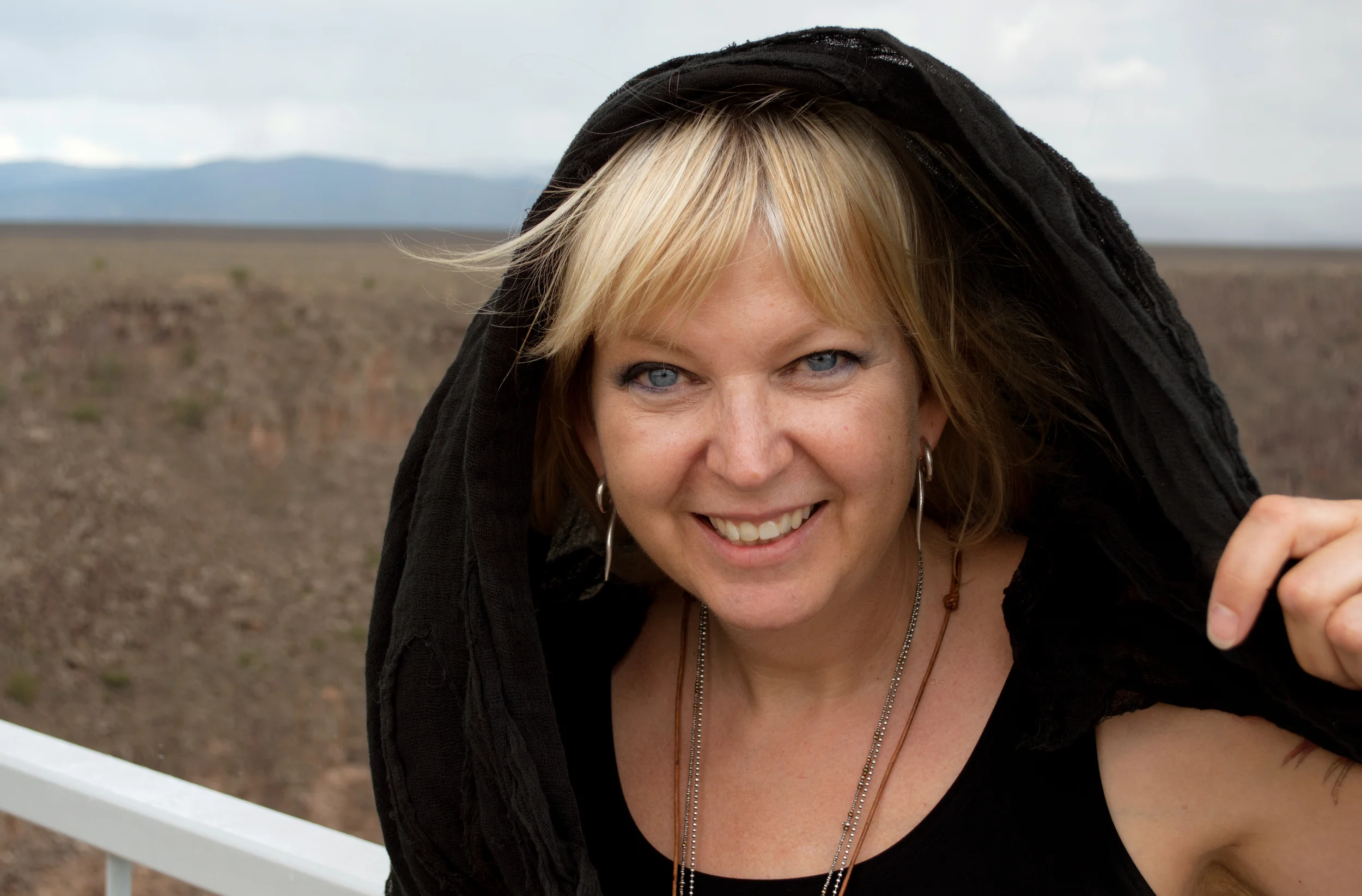 In a summer storm on the Taos Gorge Bridge high above the Rio Grande. My son, Maxwell Bush, took this photo. 