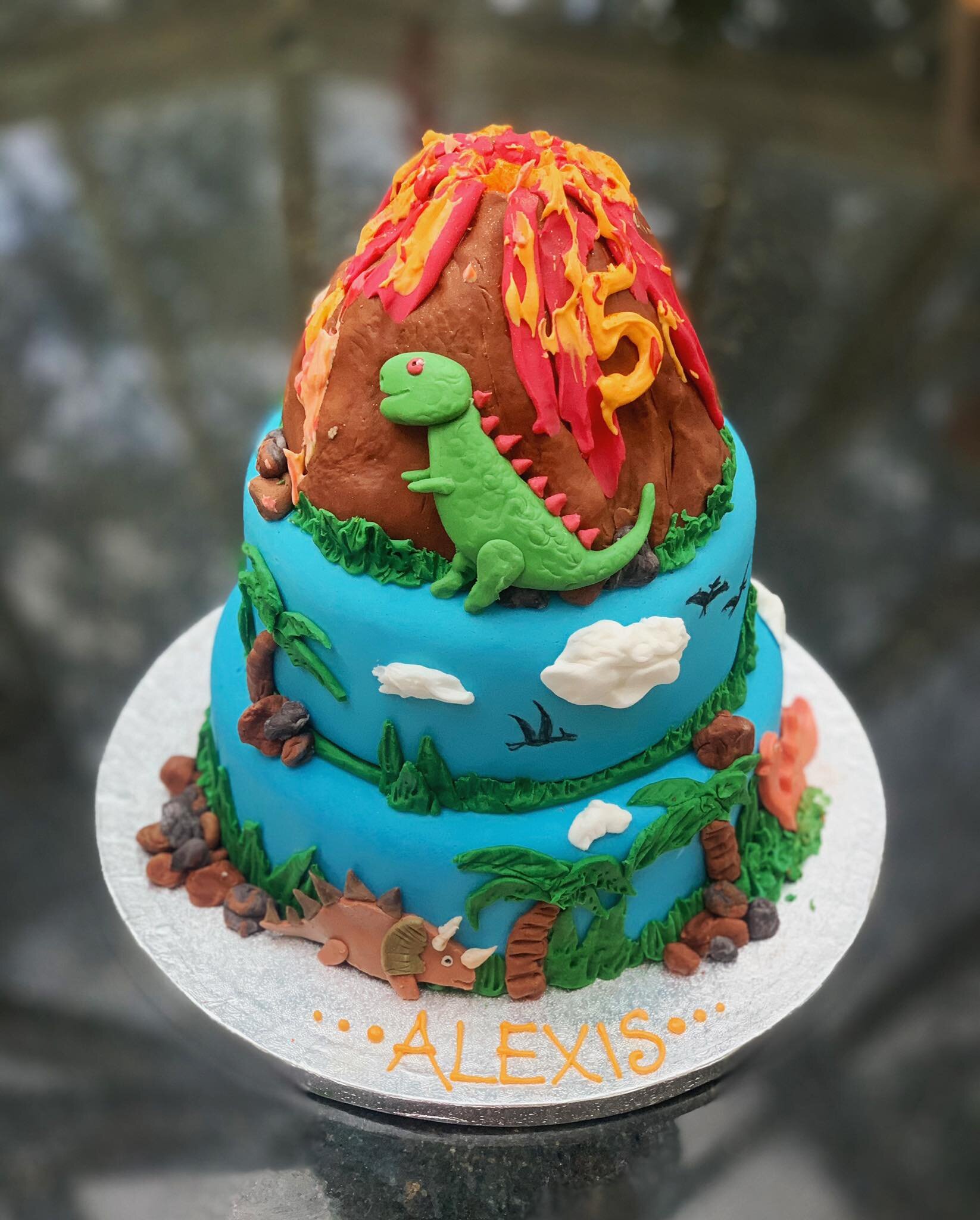 Dinosaur volcano island cake