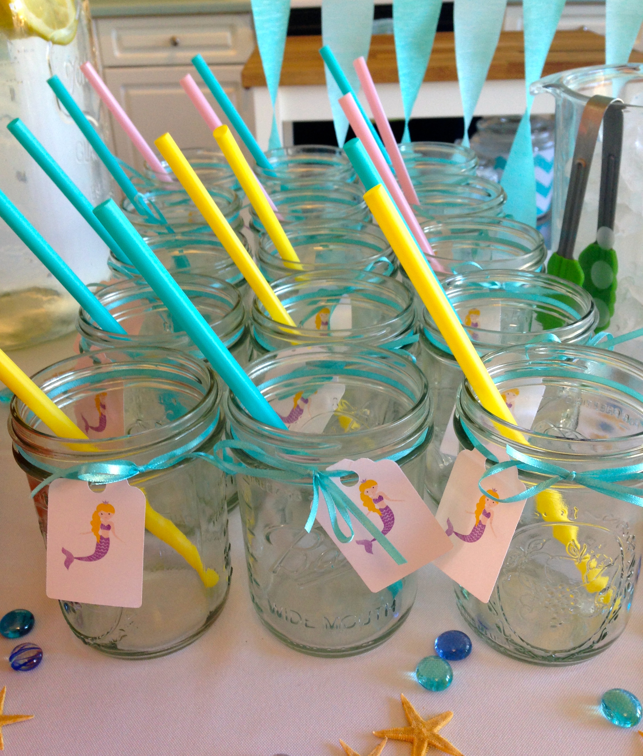 Mason jars (I have 36 to use as Party Glasses) with another mermaid graphic purchased from Petittatti on Etsy . Starfish from Michael's