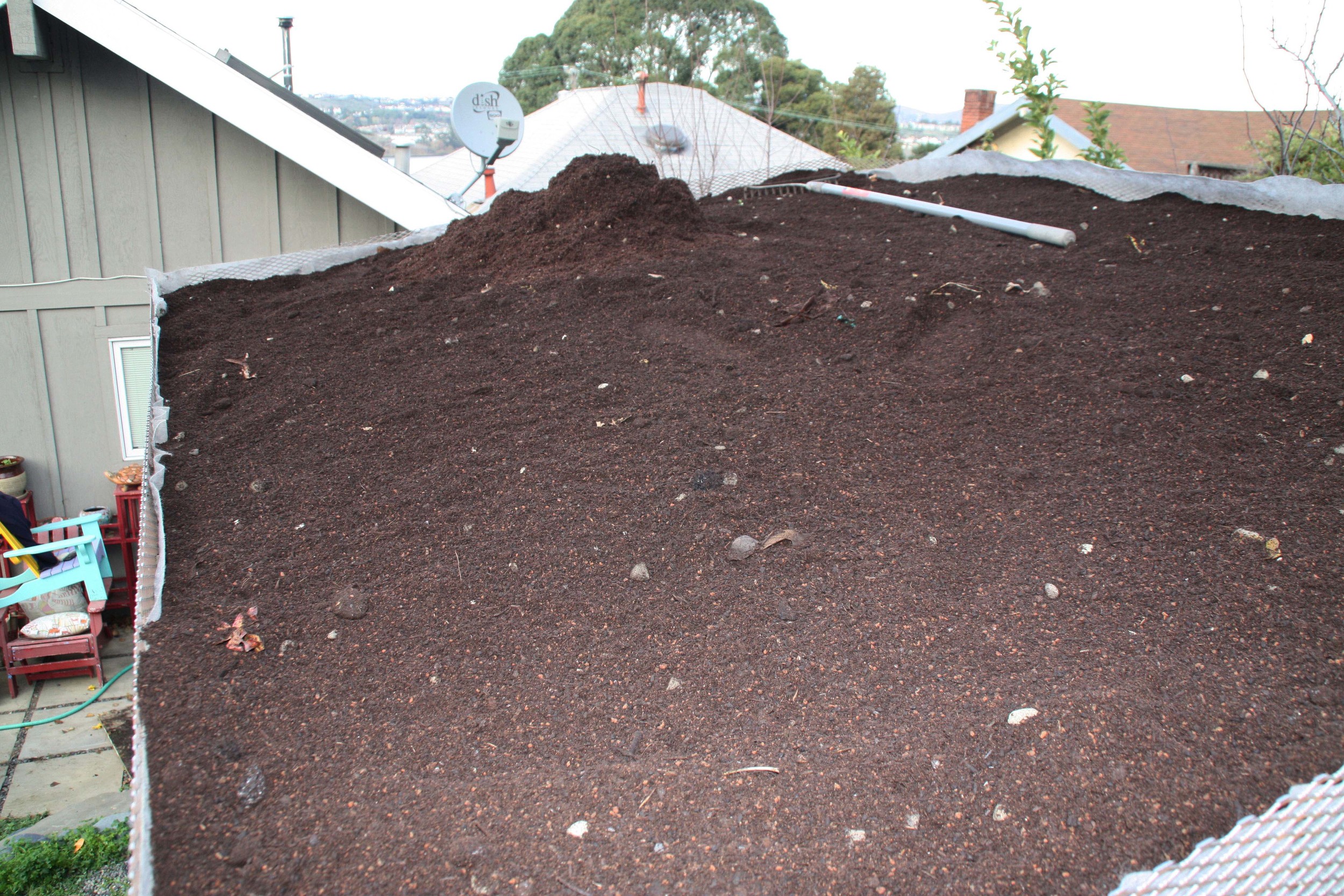 A lightweight soil is placed over the filter fabric.