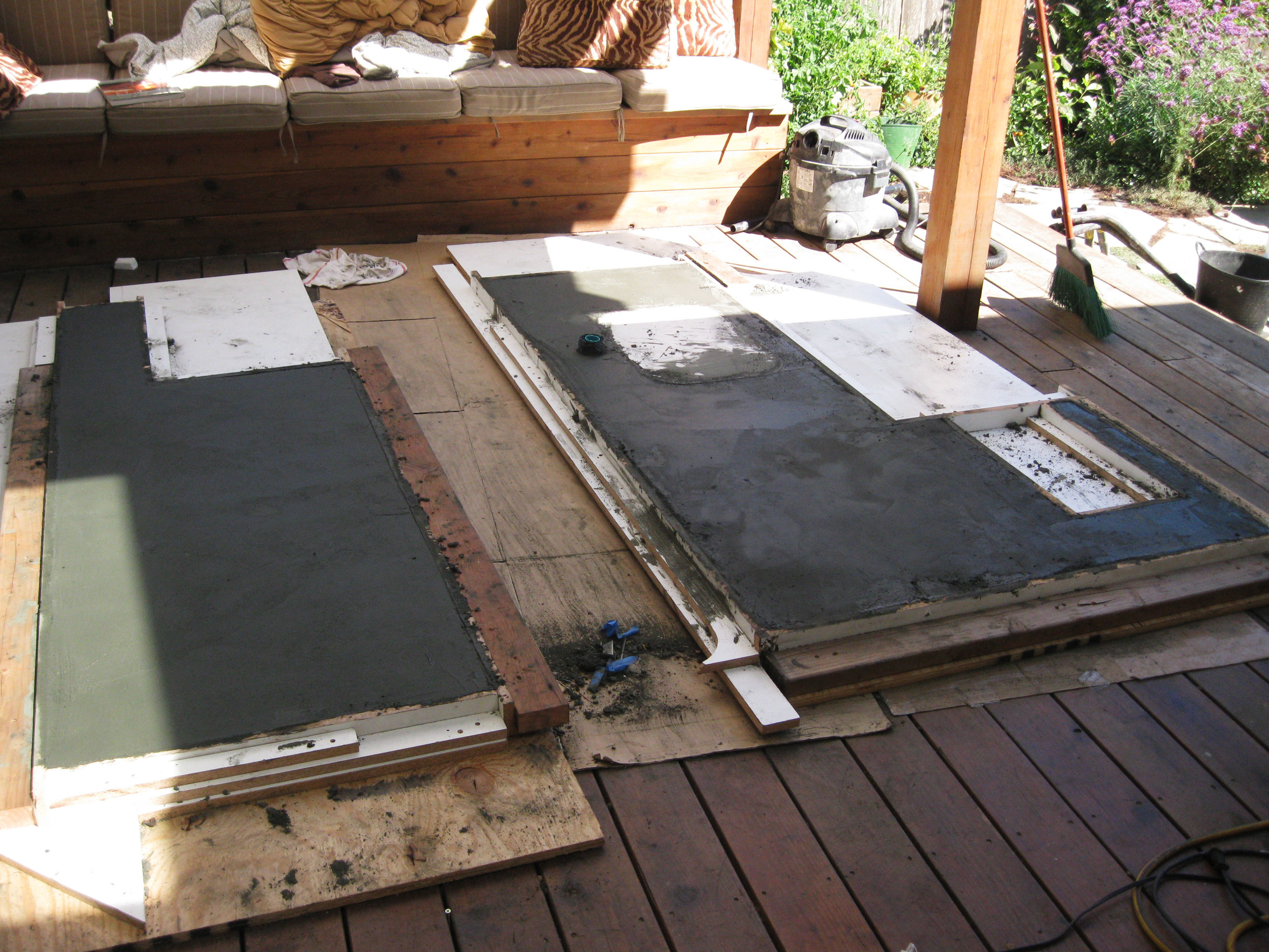Shown here are both molds with the poured concrete curing.