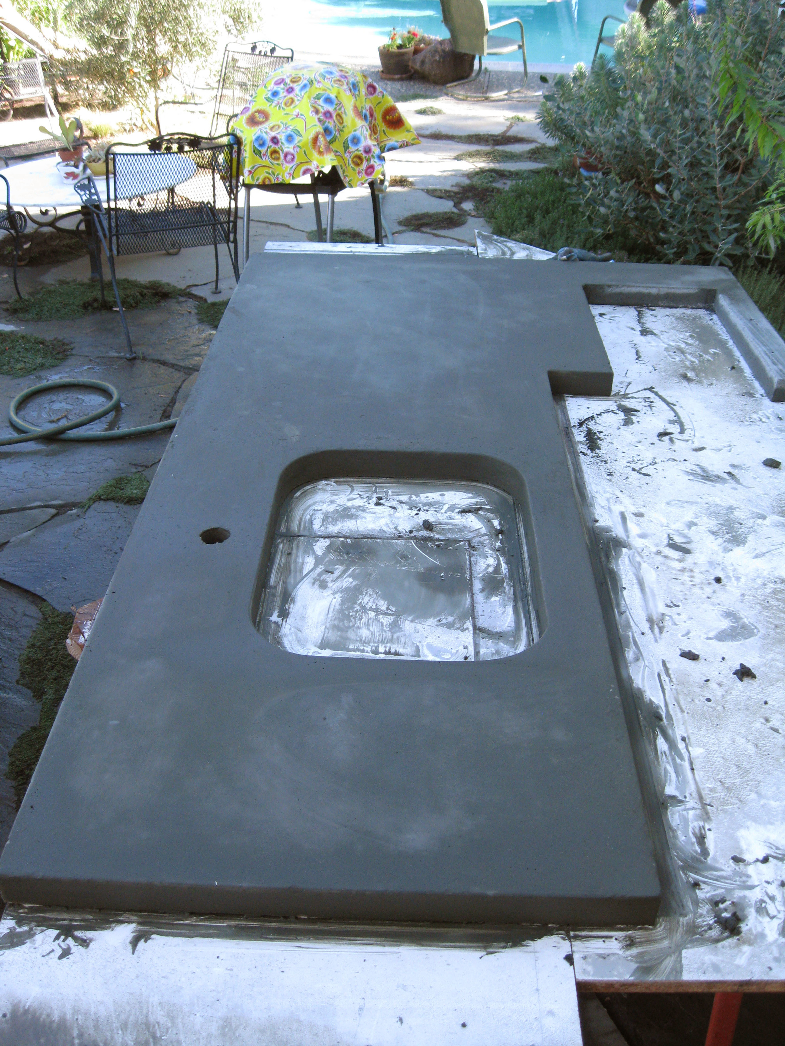 After curing, the concrete counter tops are taken out of the molds and flipped over so that the face poured against the melamine is exposed. 