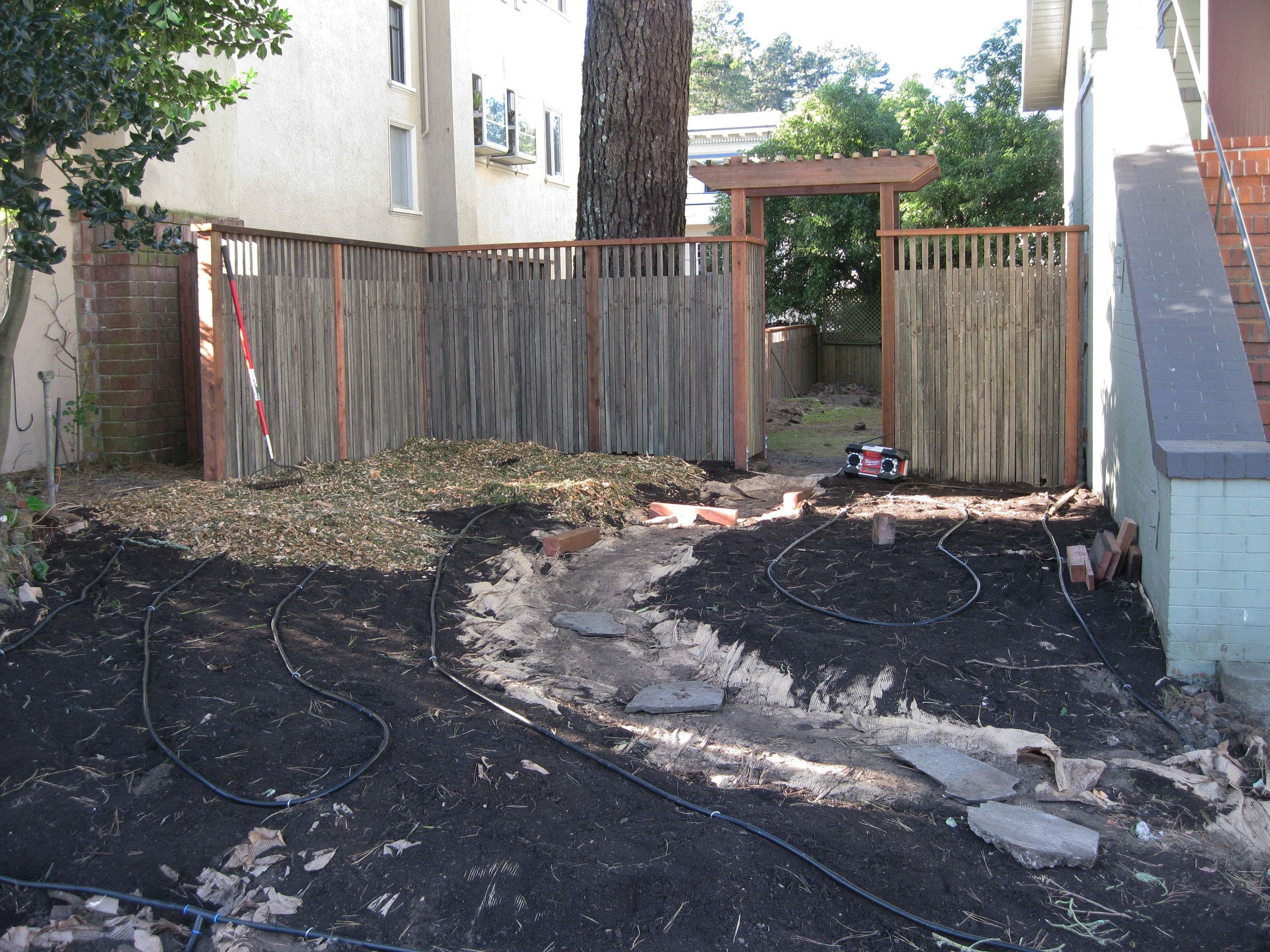 Drip Irrigation is installed and a thick layer of mulch is spread over the compost.