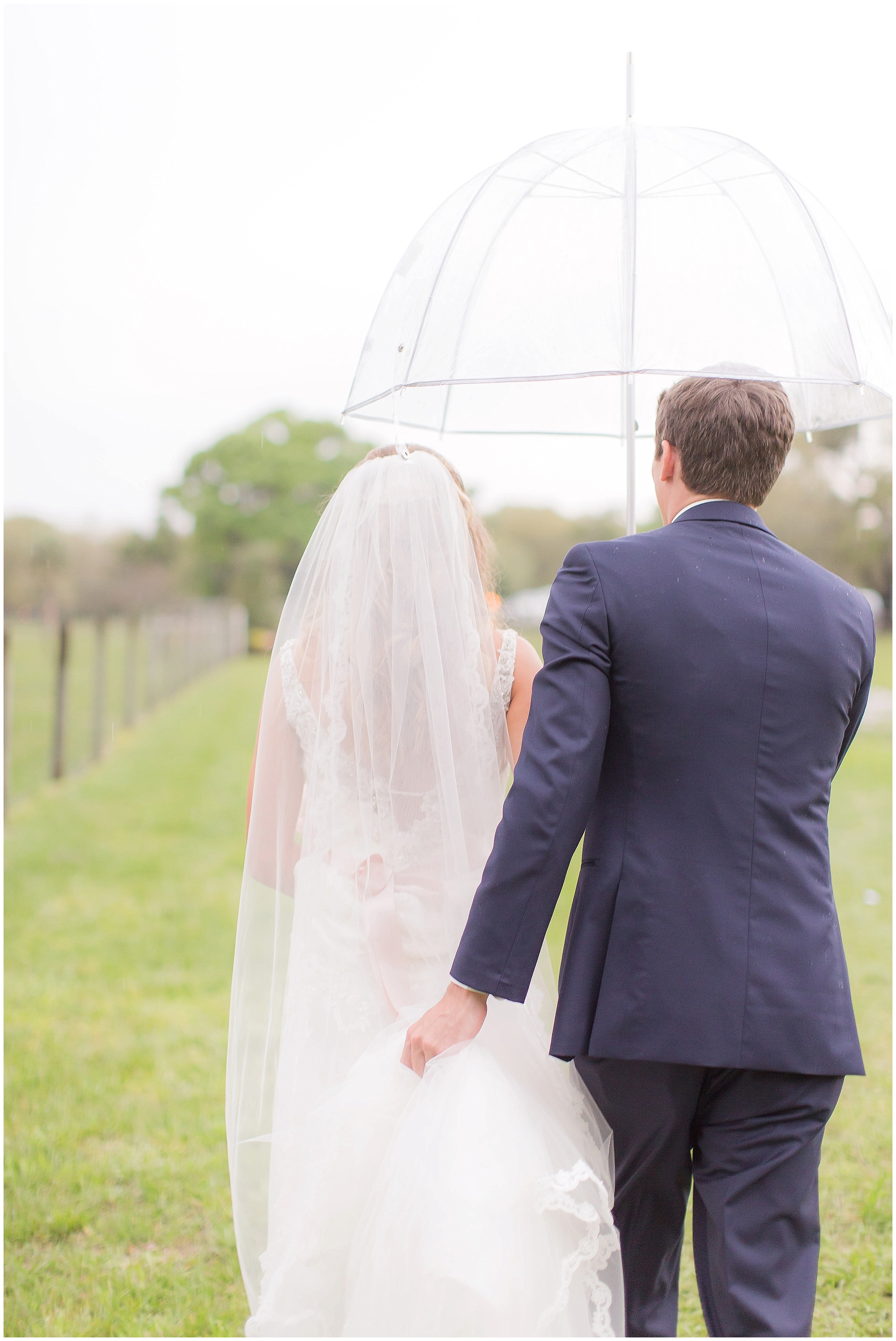 Newly Married Bride and Groom Walking after Ceremony. Beautiful Sweetheart Dress with embellishments and Blush Accents. 