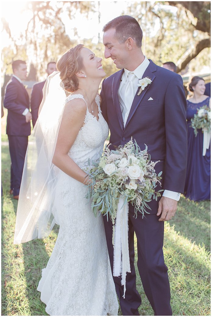 That Light!  Bridal Party in Navy with Bride and Groom 