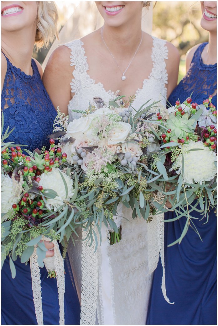 Bridesmaids in Navy with White Bouquets with berries and lace ribbon 