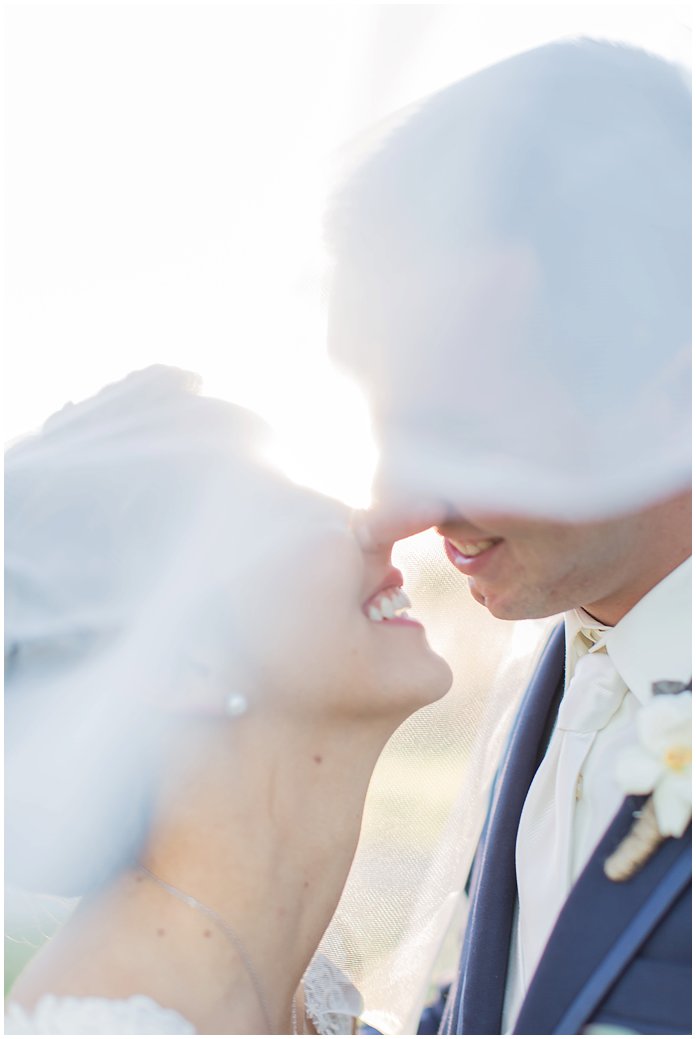 That Smile!  Bride and Groom Portrait with Romantic Veil 