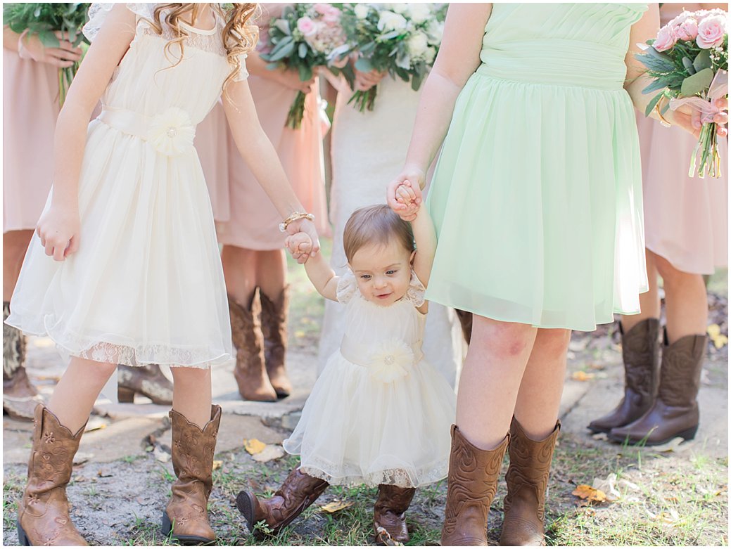 Bridle Oaks Wedding in DeLand Florida Flower Girl In Cowboy Boots with Bridesmaids Blush Wedding